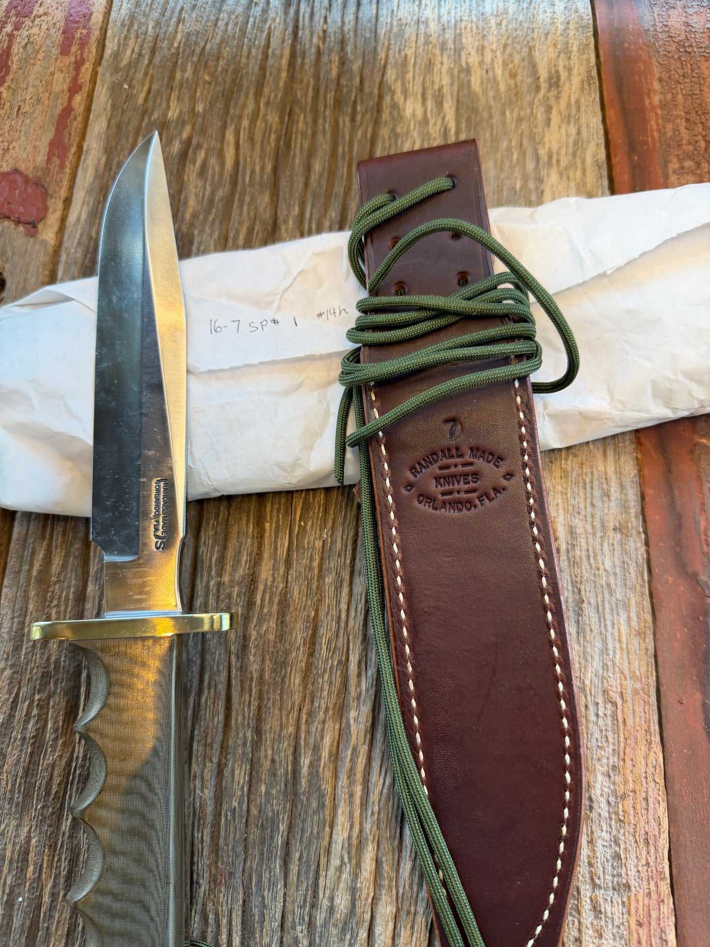 New in Paper Randall Model 16 SP#1 Special fighter with a Green Micarta handle. SS blade, Nickel silver hilt. Lanyard. Brown leather sheath.