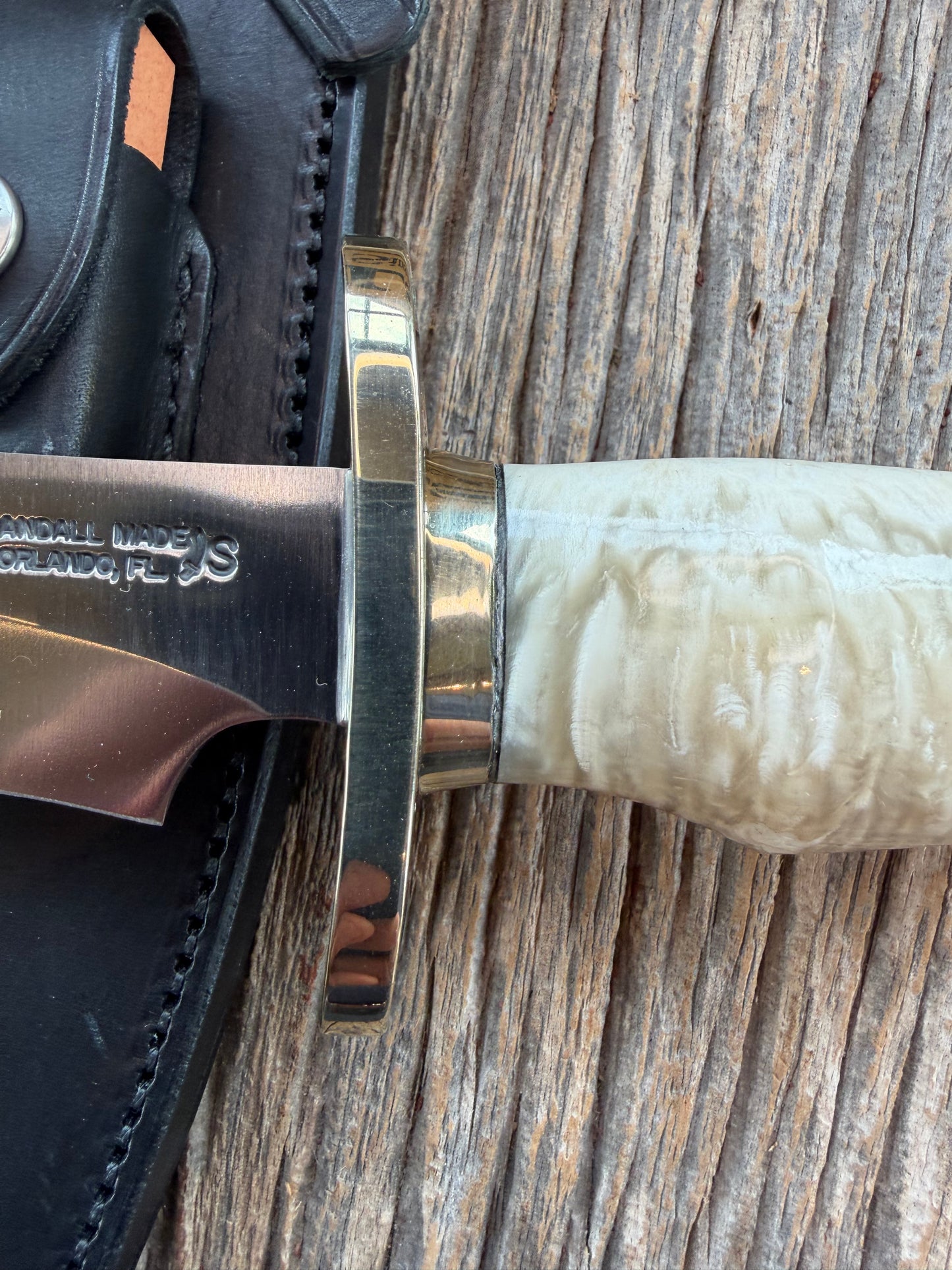 Randall Model 12-8 Small Sasquatch with a nice piece of Musk Ox. Nickel Silver collar and raw natural end.