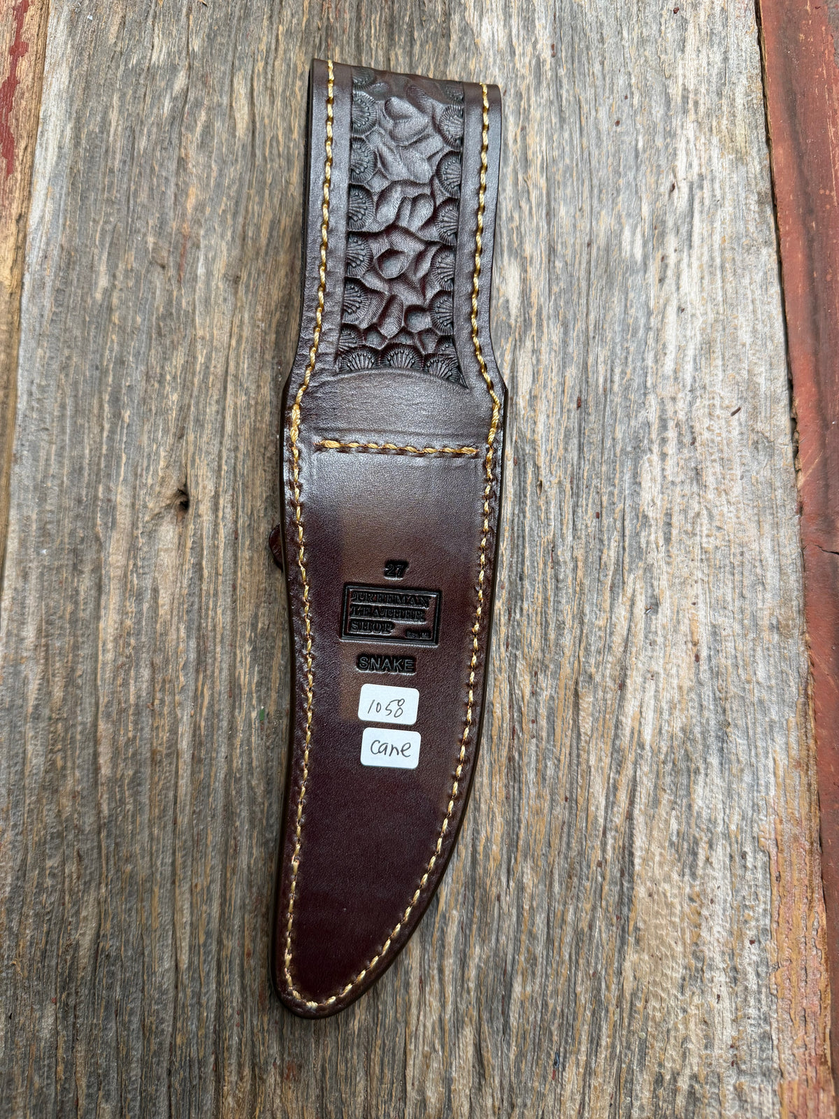 Randall Model 27 sheath with a Canebrake RattleSnake skin from Treeman Sheaths. Vibrant colors and along side Copperheads the hardest skin to source.