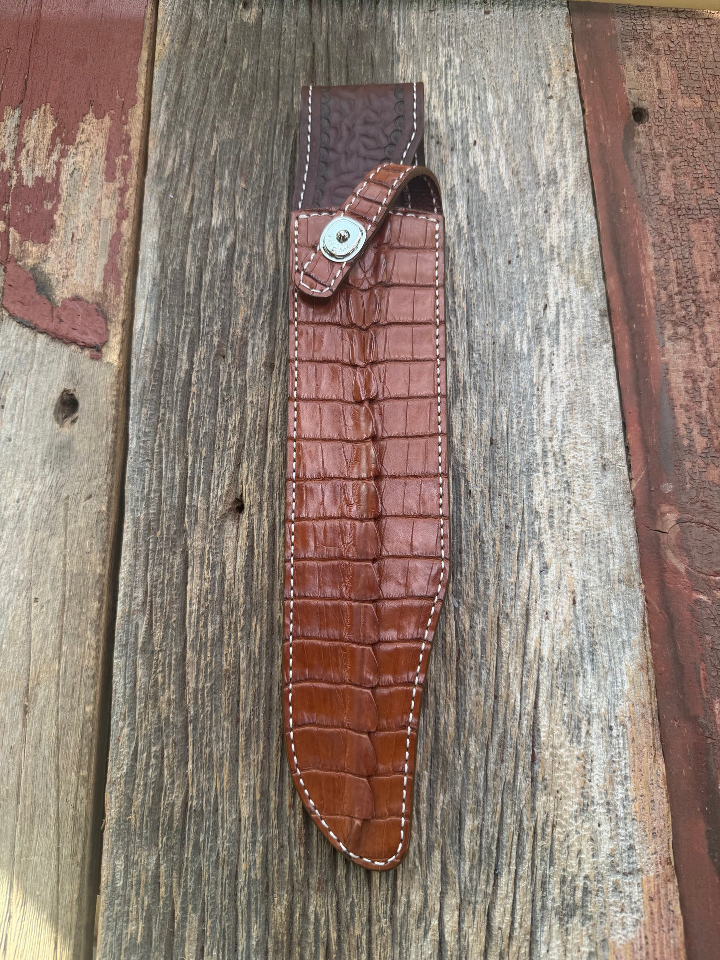 New Randall Model 12-11 Confederate Sheath in Exotic thick and textured Honey Crocodile skin ( tail portion) on brown leather from Treeman with a silver Canteen snap. Hand tooled belt loop. Killer sheath.