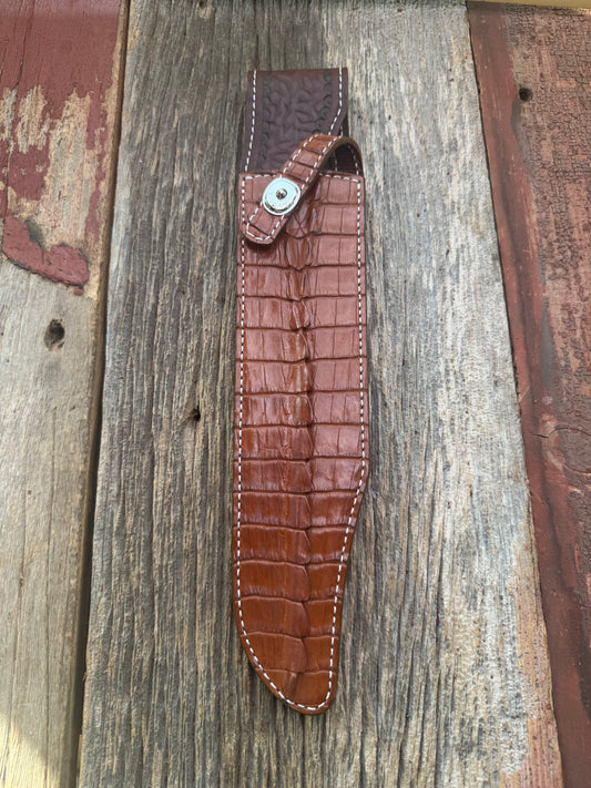 New Randall Model 12-11 Confederate Sheath in Exotic thick and textured Honey Crocodile skin ( tail portion) on brown leather from Treeman with a silver Canteen snap. Hand tooled belt loop. Killer sheath.