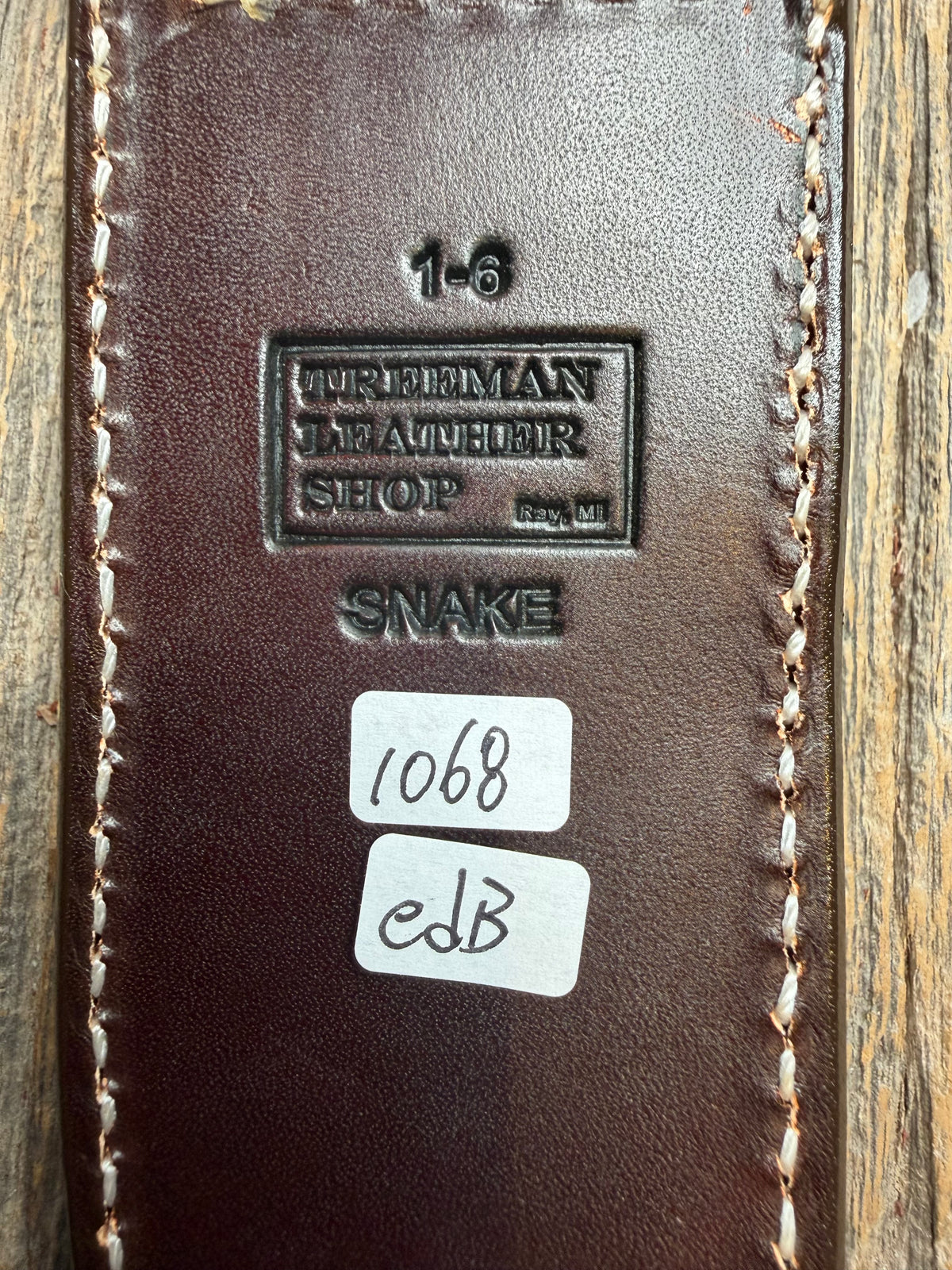 Randall Model 1-6 sheath with an Eastern Diamondback RattleSnake skin from Treeman Sheaths. Hand tooled belt loop, canteen snap. One the hardest skins to source.