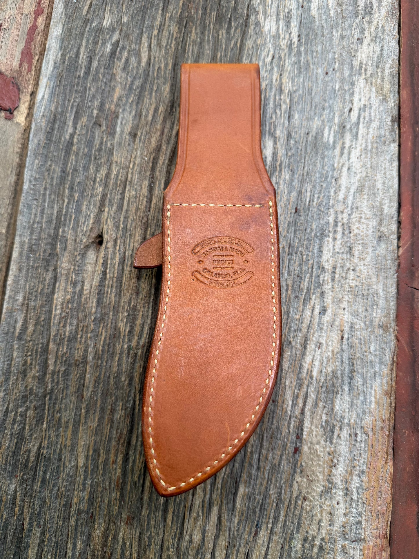 Randall by Gutcher Knife Sheath for a Model Rick Bowles Special.  Randall snaps, pouch with stone. Tuff sheath.