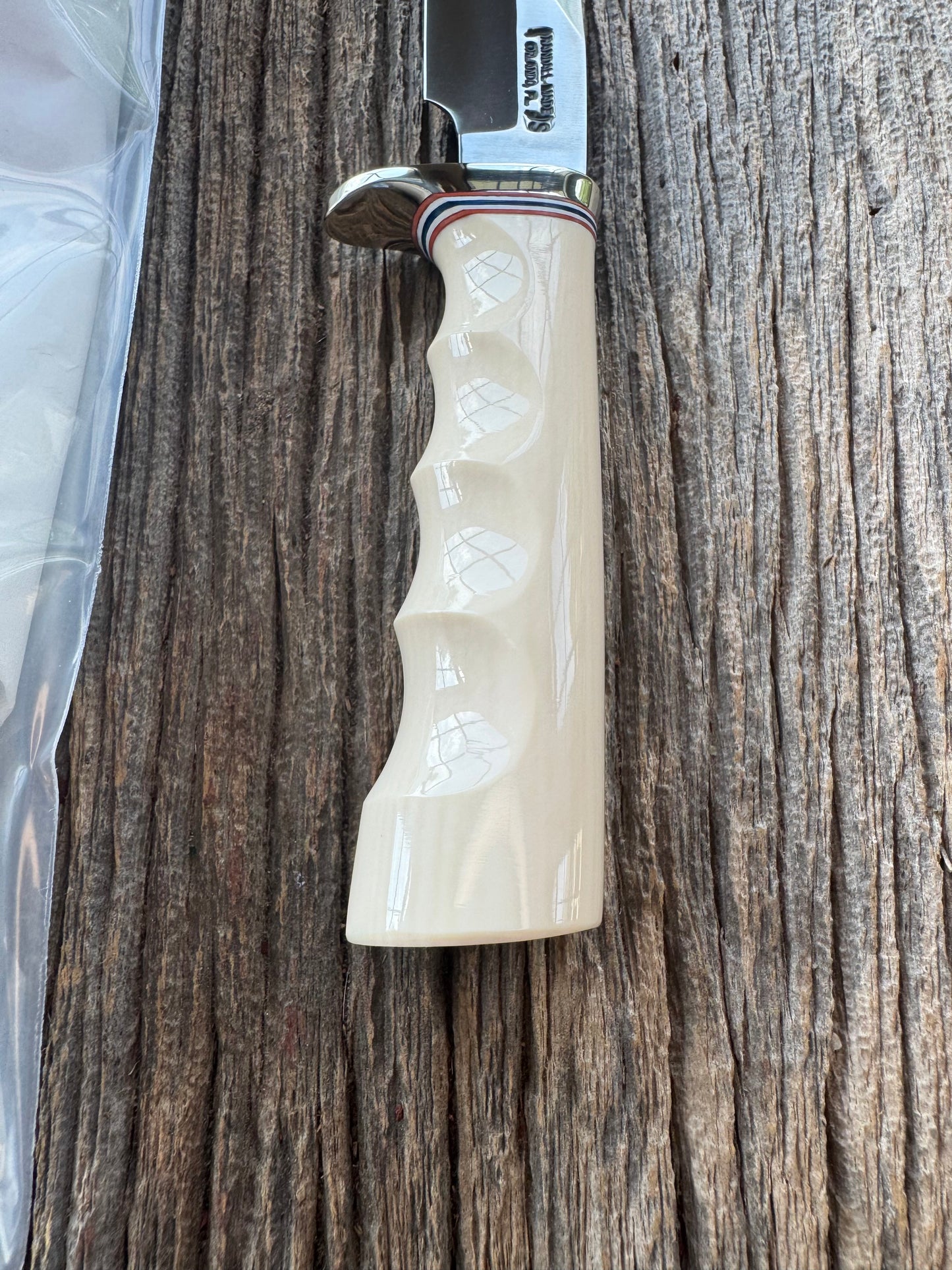 Randall Model Combat Companion with a nice piece of customer supplied Warthers Resin with finger grooves. Teeth, Stainless Steel, Nickel Silver Hilt and a raw natural end.