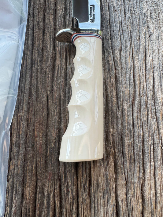 Randall Model Combat Companion with a nice piece of customer supplied Warthers Resin with finger grooves. Teeth, Stainless Steel, Nickel Silver Hilt and a raw natural end.