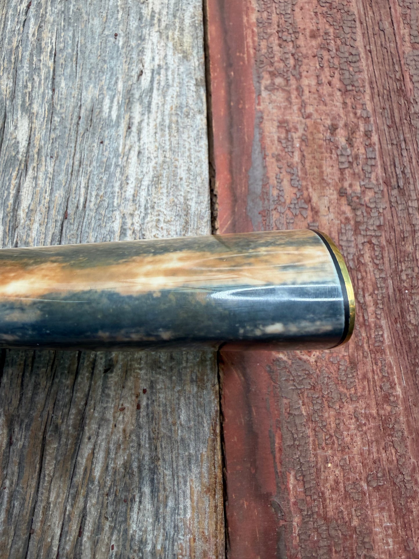 Randall Model 12-11 Smithsonian “Smitty” in a Huge piece of Green, Brown and Blue Fossil Walrus Ivory. Brass Hilt and Brass Butt plate fully engraved in Silver from Jere Davidson.  Stunning piece.