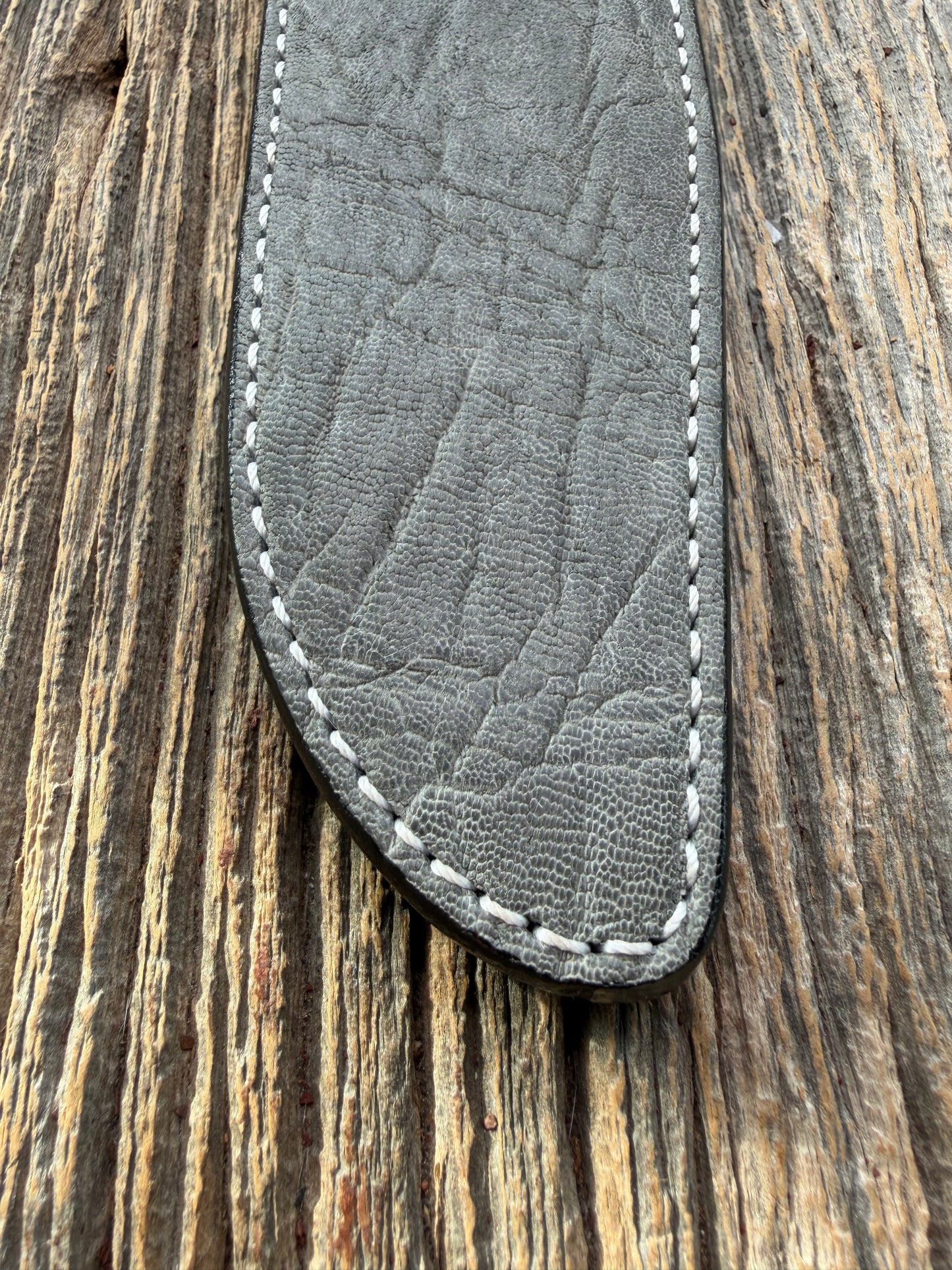 New Randall Model 1-8 Sheath in Exotic thick and textured Grey Elephant Hide on black leather from Treeman with a silver Canteen snap. Hand tooled belt loop. Killer sheath.