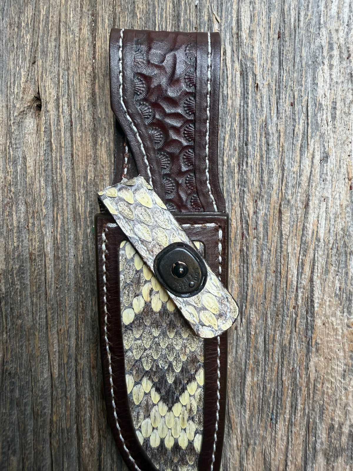 Randall Model 23 sheath with an Eastern Diamondback RattleSnake skin from Treeman Sheaths. Hand tooled belt loop, canteen snap. One the hardest skins to source.