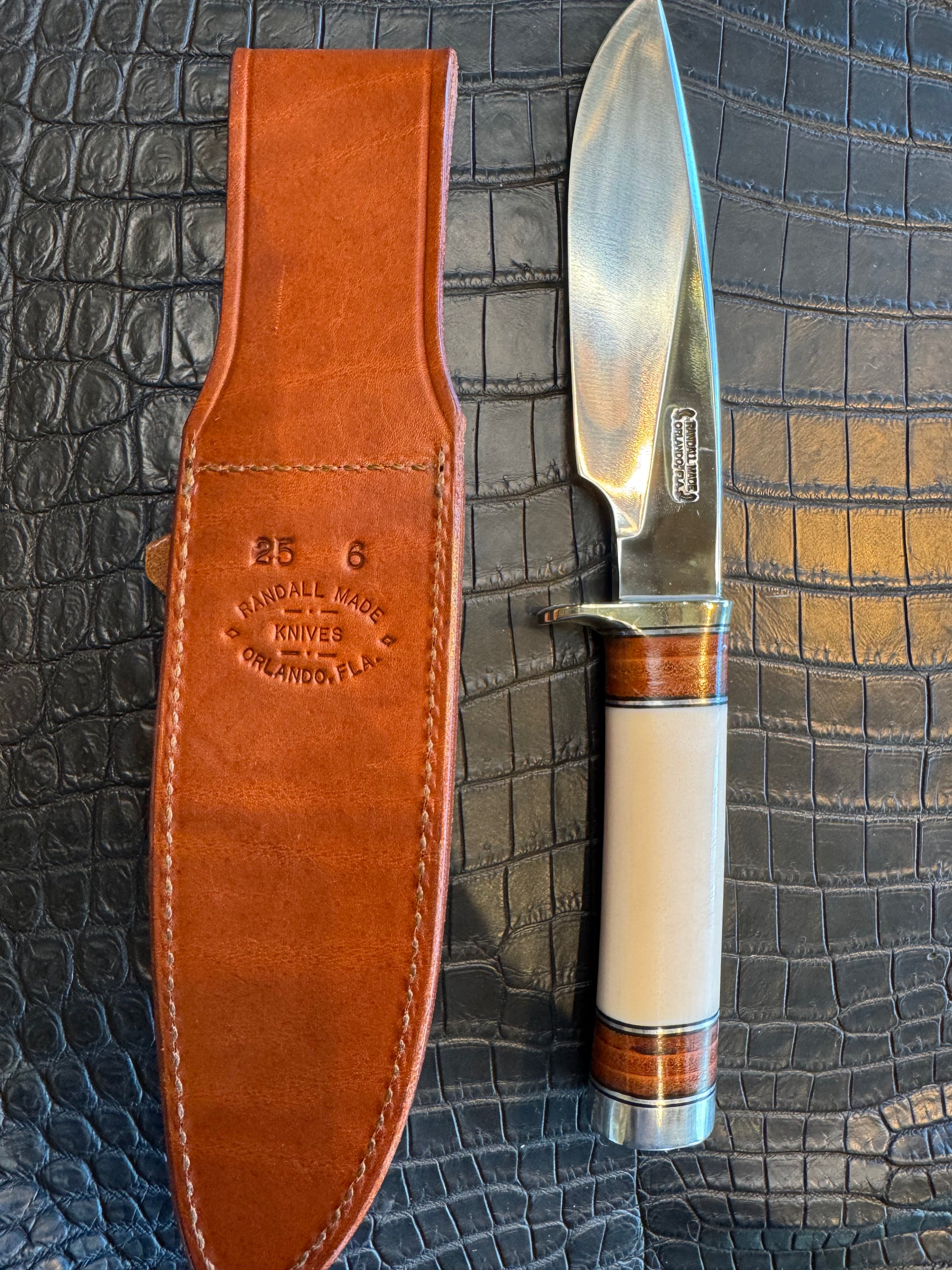 Randall Model 25-6 in Elephant Ivory with stacked Leather, Nickel Silver Hilt and Aluminum Butt cap. Flawless.
