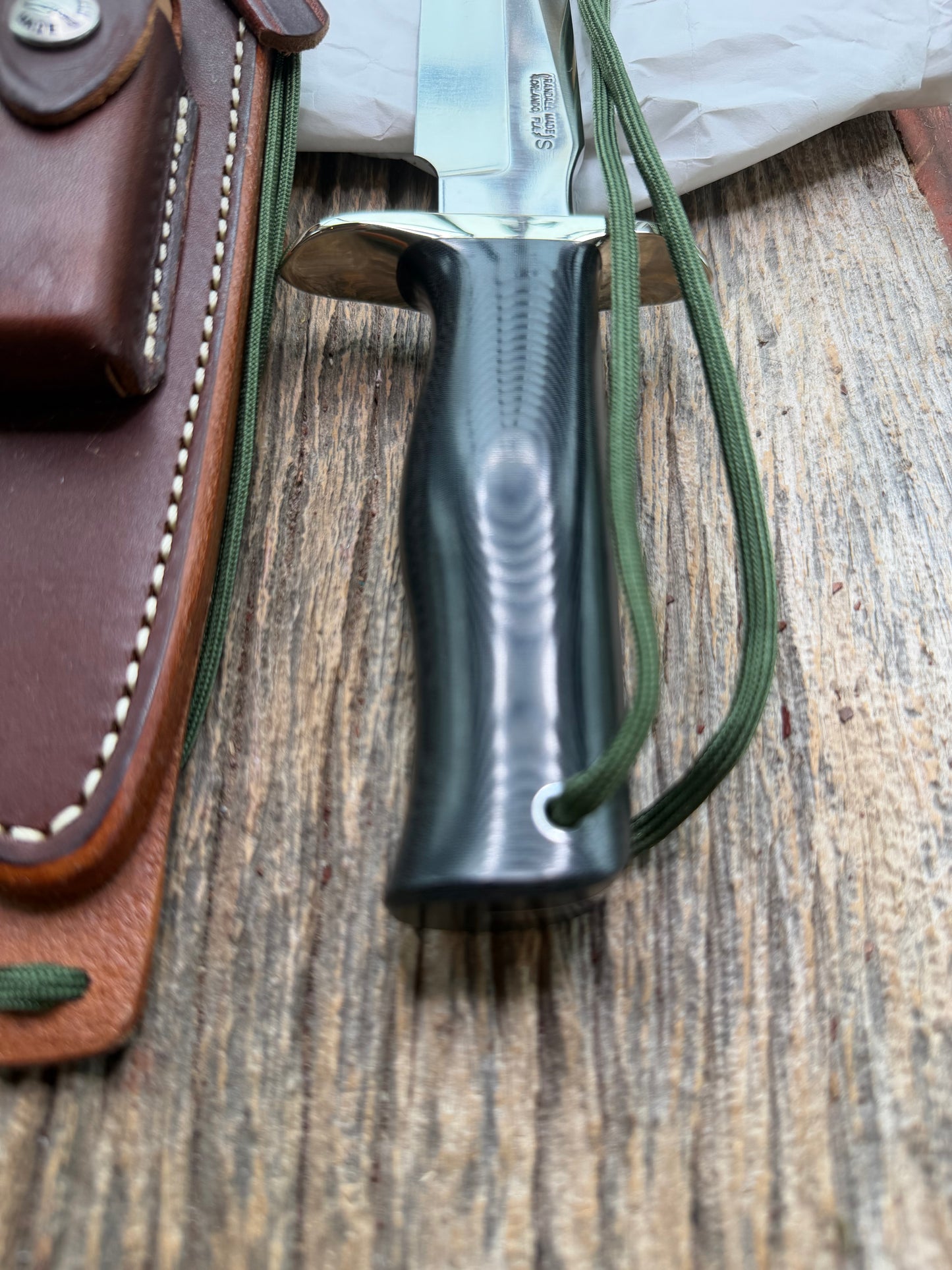 New in Paper Randall Model 16 SP#1 Special fighter with a Black Micarta handle. SS blade, Nickel silver hilt. Lanyard. Brown leather sheath.