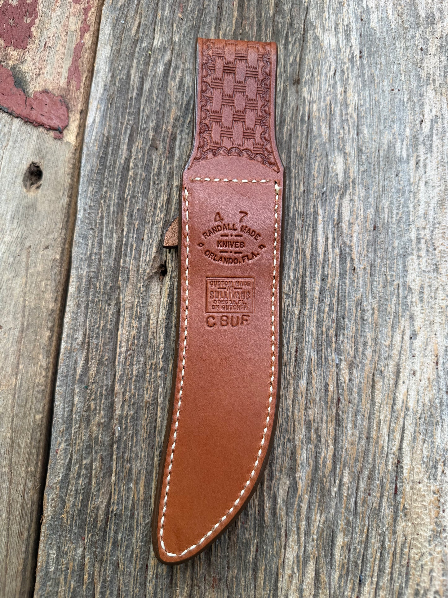 Pristine Randall Model 4-7 sheath in Exotic Cape Buffalo leather from Sullivans by Gutcher. Heavily tooled belt loop and strap. Randall snap and clean stamping on the back … perfect!!