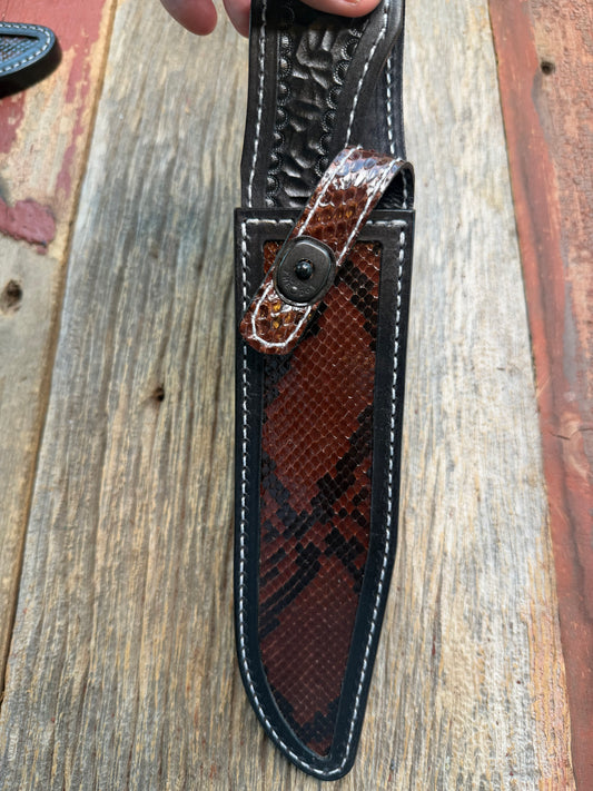 New Randall Model 1-8 Sheath in Exotic Brown Python Snake skin on black leather from Treeman with a black Canteen snap. Hand tooled belt loop. Deviated white stitching. Killer sheath.