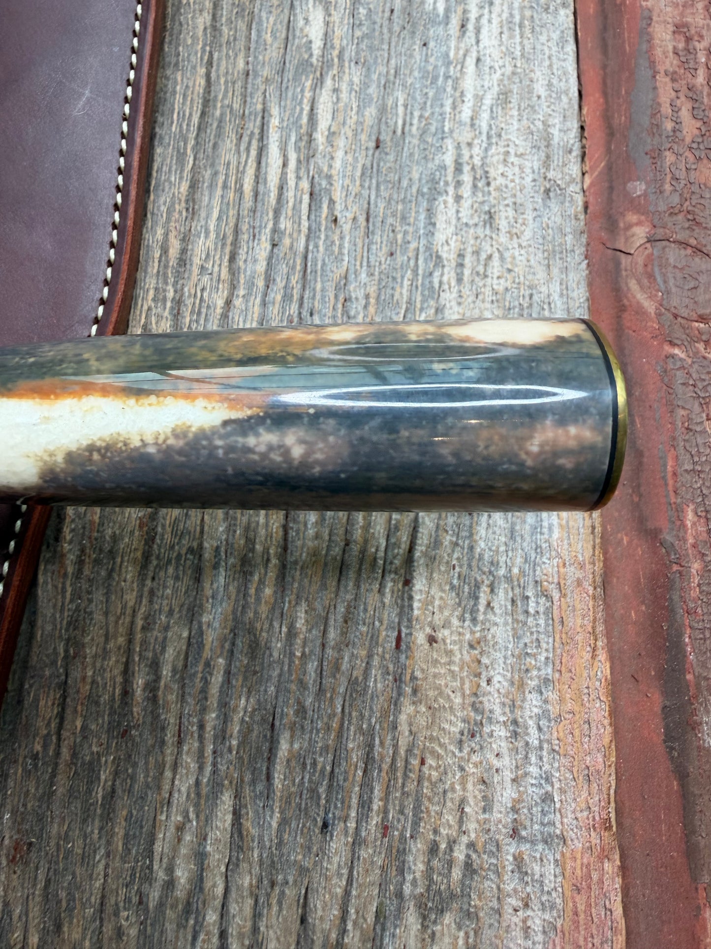 Randall Model 12-11 Smithsonian “Smitty” in a Huge piece of Green, Brown and Blue Fossil Walrus Ivory. Brass Hilt and Brass Butt plate fully engraved in Silver from Jere Davidson.  Stunning piece.