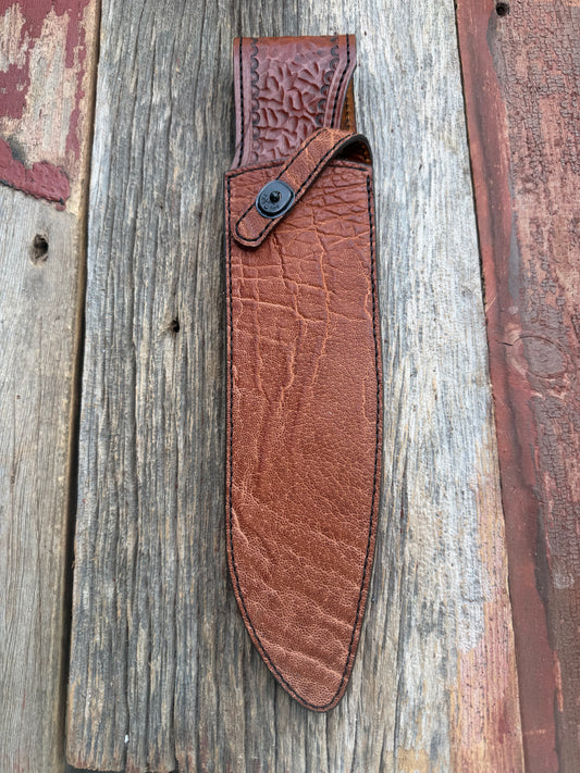 New Randall Model 12-11 Large Sasquatch Sheath in Exotic thick and textured Rust colored Elephant hide on brown leather from Treeman with a black Canteen snap. Hand tooled belt loop. Killer sheath.