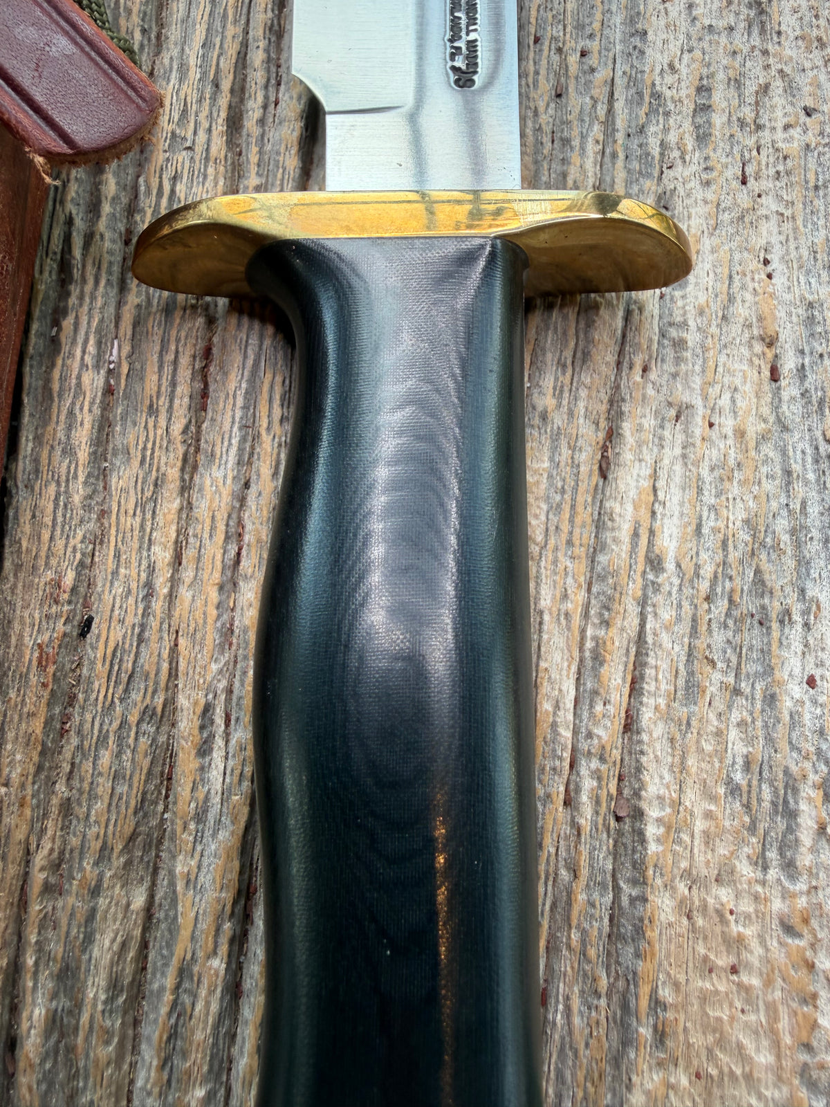Nice Randall Model Combat Companion in Black Micarta. SS blade, brass hilt. Lanyard and paracord, Brown leather sheath.