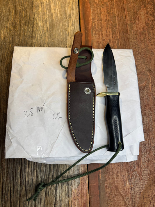 New in Paper Randall Model 28 Woodsman in Black Micarta. SS blade, brass single hilt. Lanyard. Brown leather sheath.