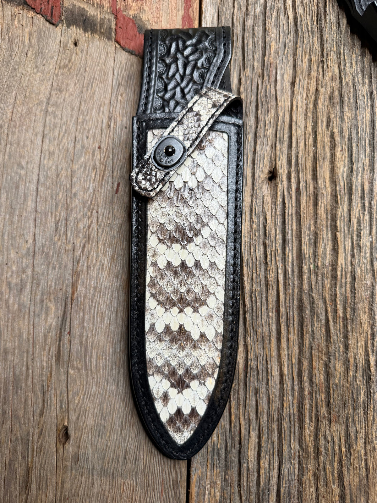 Randall Model Clinton Special sheath with an Eastern Diamondback RattleSnake skin from Treeman Sheaths. Hand tooled belt loop, canteen snap. One the hardest skins to source.