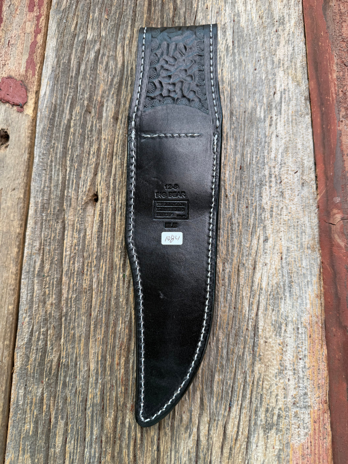 New Randall Model 12-8 Sheath in Exotic Black Matte Elephant Hide from Treeman with a Black Canteen snap. White thread deviated stitching on black leather..Killer sheath.