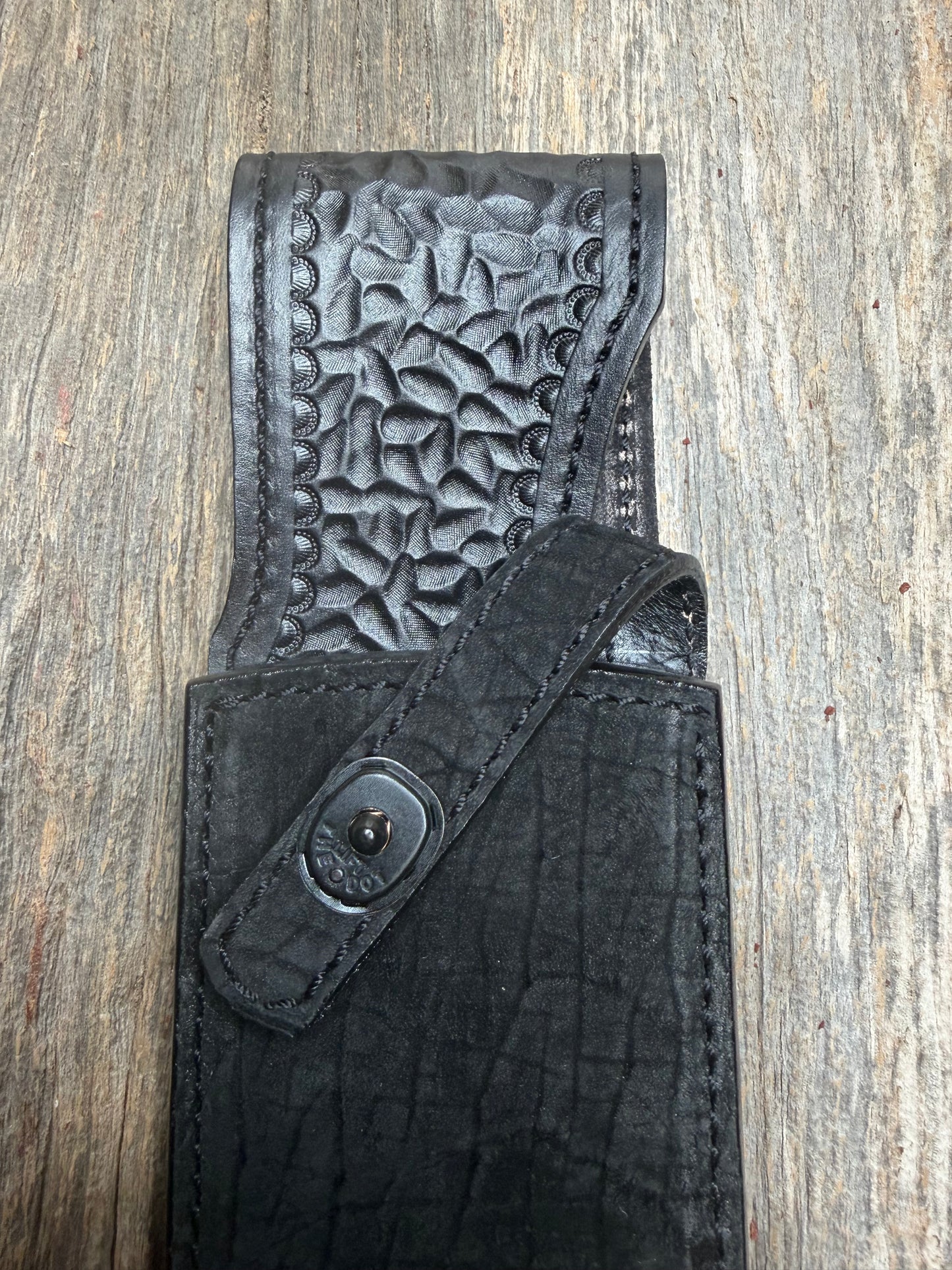 Randall Model 12-11 Large Sasquatch in Black Hippo, forward curved hilt, black Canteen Snap, full brass stamping and stitching.