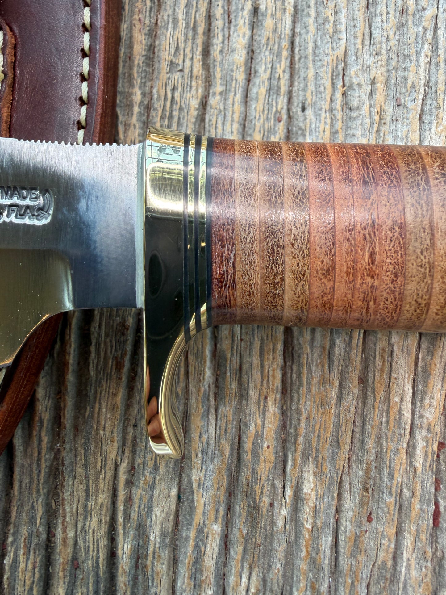 New Randall Model 19-5 Bushmaster with a Leather handle. Carbon blade, Brass single hilt. Brown leather sheath.