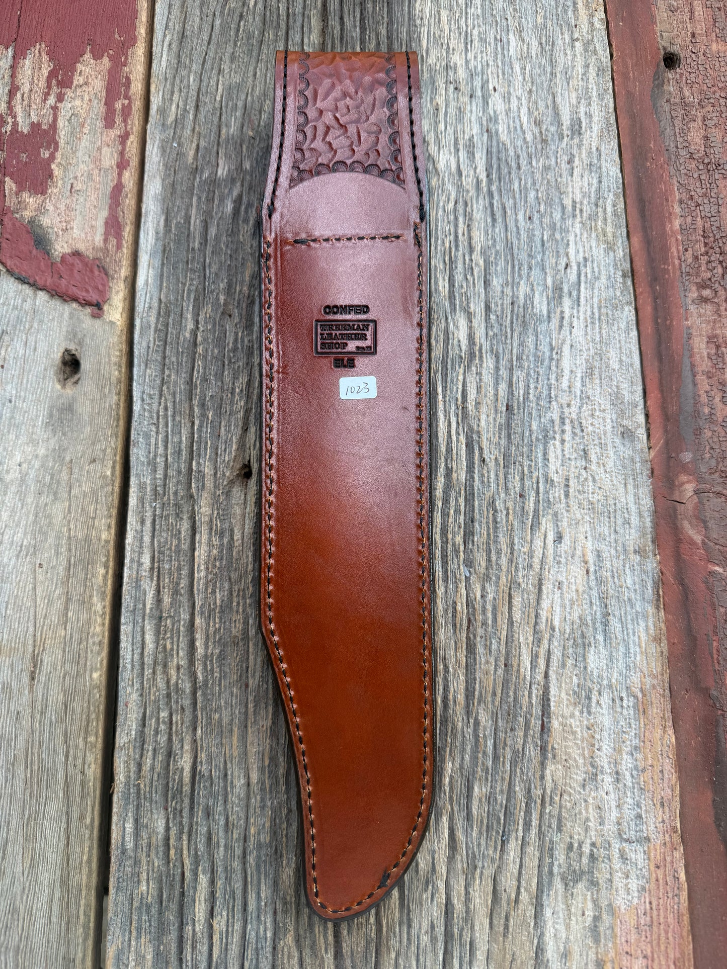 New Randall Model 12-11 Confederate Sheath in Exotic thick and textured Rust colored Elephant hide on brown leather from Treeman with a black Canteen snap. Hand tooled belt loop. Killer sheath.