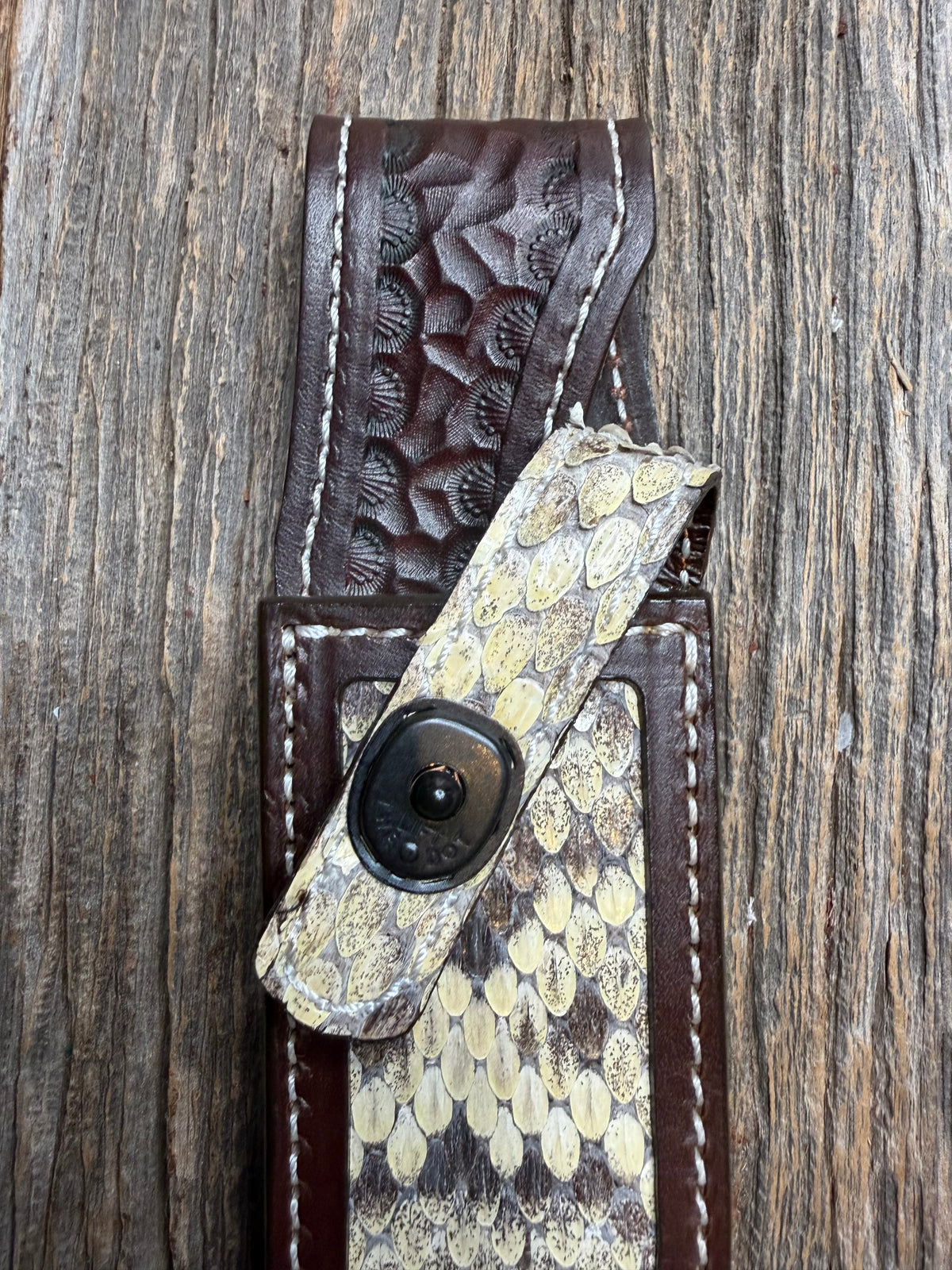 Randall Model 1-6 sheath with an Eastern Diamondback RattleSnake skin from Treeman Sheaths. Hand tooled belt loop, canteen snap. One the hardest skins to source.