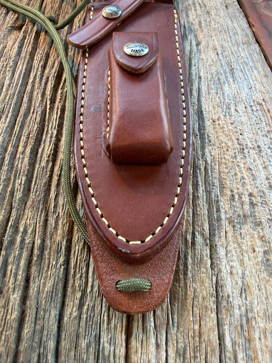 Mint Randall by Gutcher Knife Sheath for a Model Buxton Fighter. Randall snaps, double stitched, pouch with stone, lanyards straps as well.