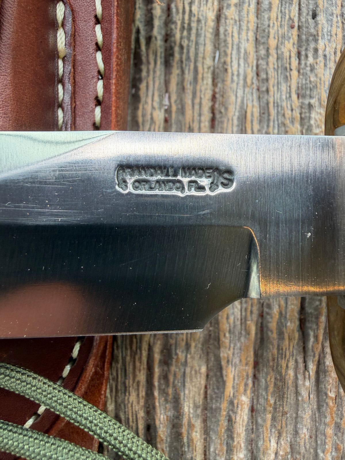 Nice Randall Model Combat Companion in Black Micarta. SS blade, brass hilt. Lanyard and paracord, Brown leather sheath.
