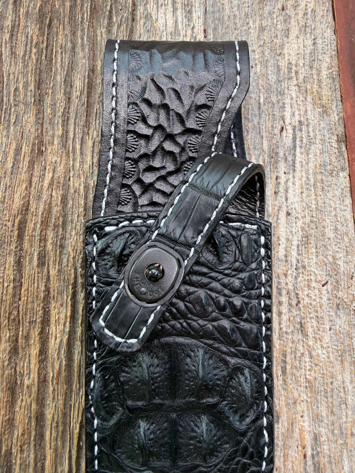 New Randall Model 12-8 Sheath in Exotic Black Matte Crocodile skull from Treeman with a Black Canteen snap. White thread deviated stitching on black leather..Killer sheath.