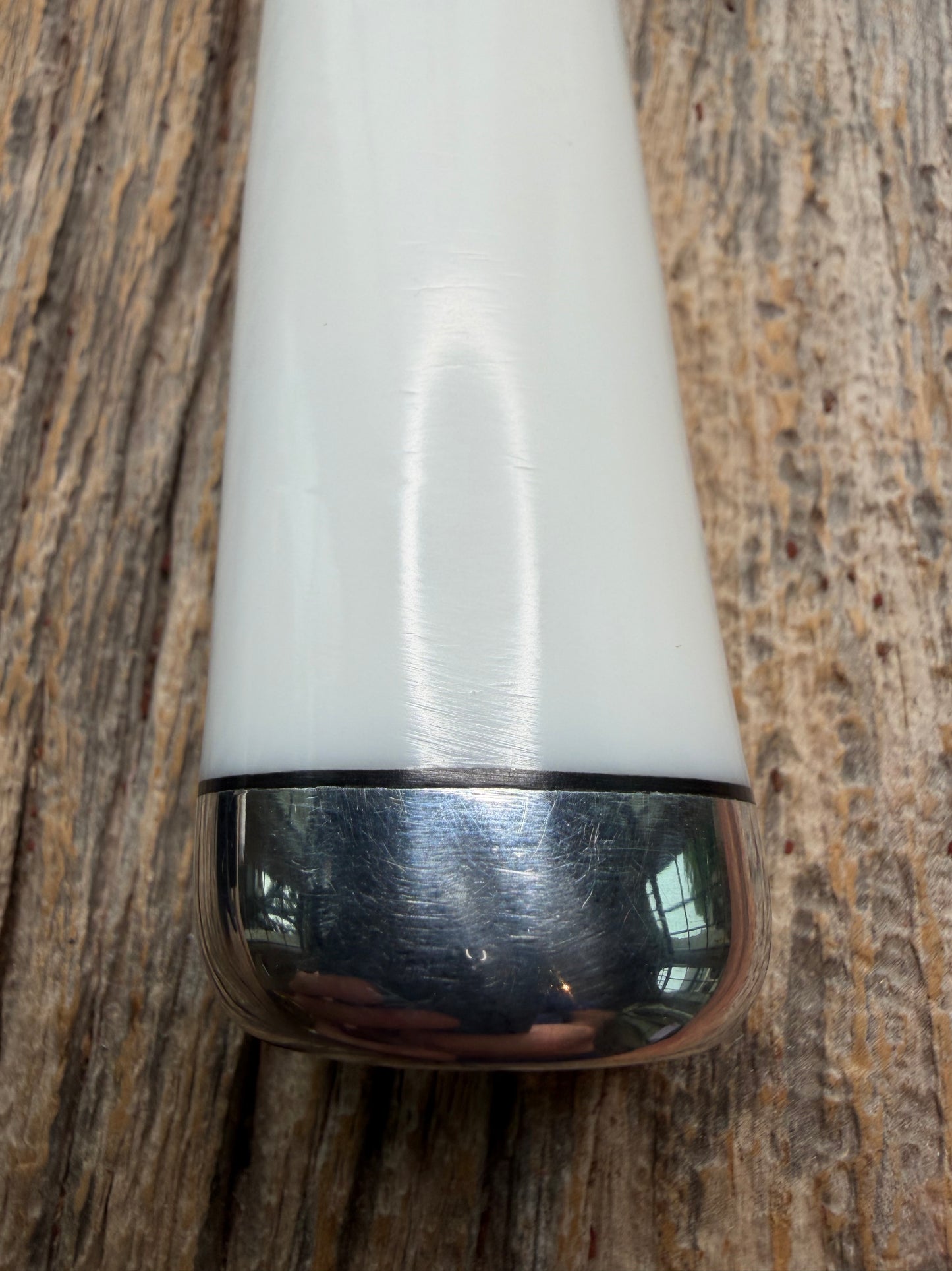 Randall Model 14-7.5 with a White Ivorite handle. Stainless steel blade, Nickel silver hilt and collar. Upgraded Black leather sheath.  Roundsd Aluminum butt cap.