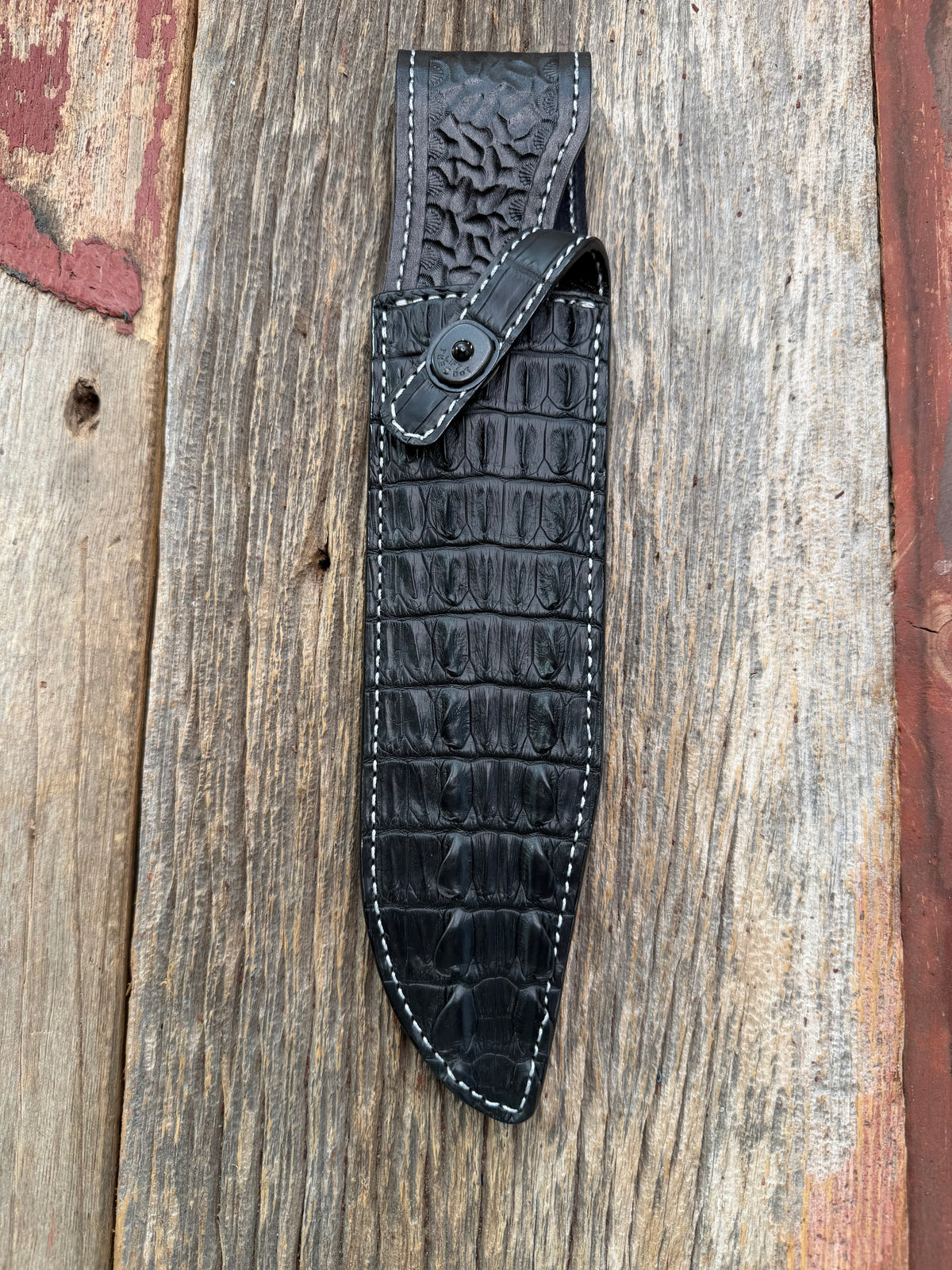 New Randall Model 12-9 Sheath in Exotic Black Matte Crocodile tail from Treeman with a Black Canteen snap. White thread deviated stitching on black leather..Killer sheath.
