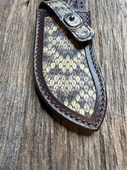 Randall Model Bowles Special sheath with an Eastern Diamondback RattleSnake skin from Treeman Sheaths. Hand tooled belt loop, canteen snap. Vibrant colors and one of the hardest skins to source.