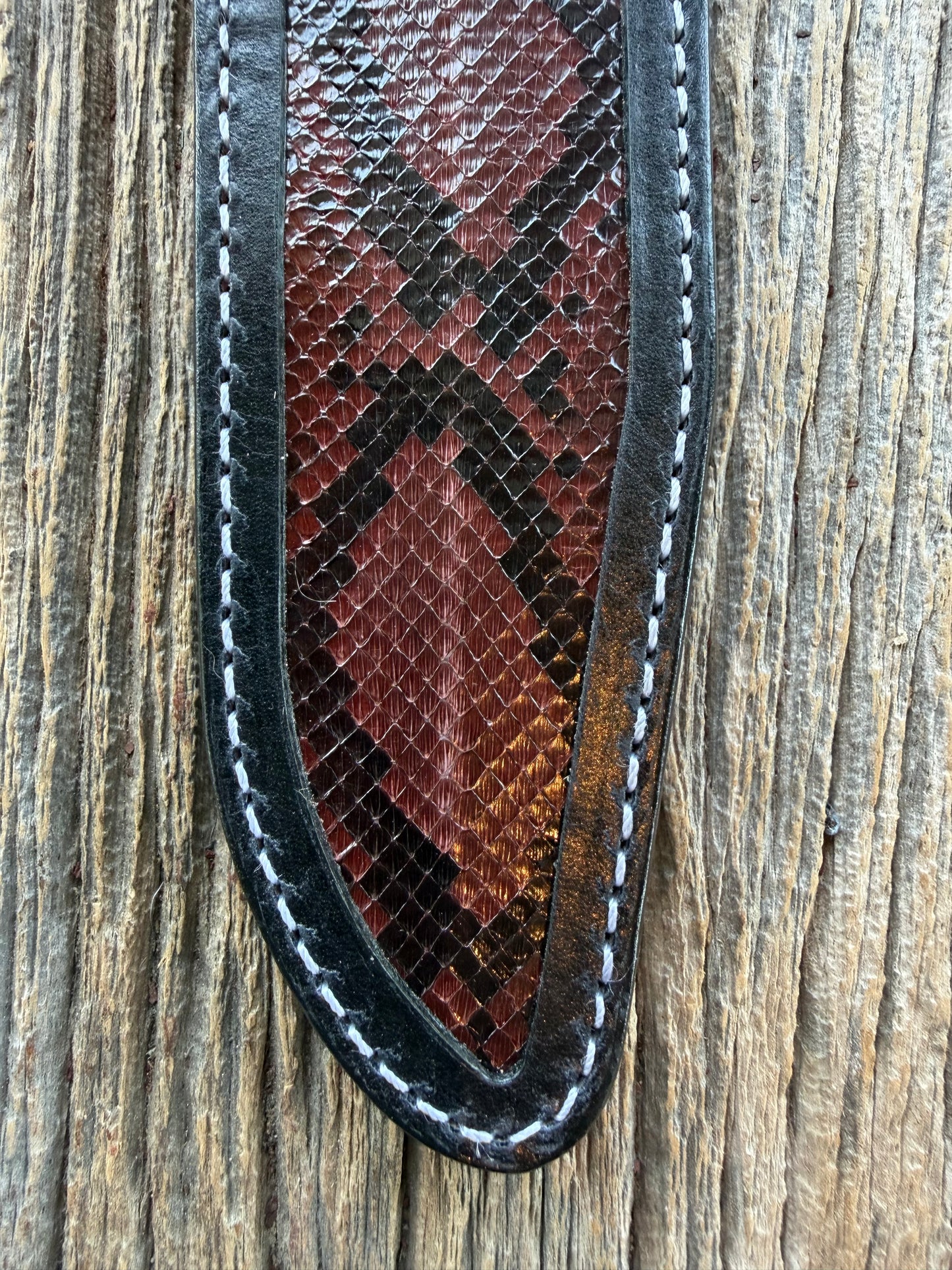 New Randall Model 1-7 Sheath in Exotic Brown Python Snake skin on black leather from Treeman with a black Canteen snap. Hand tooled belt loop. Deviated white stitching. Killer sheath.