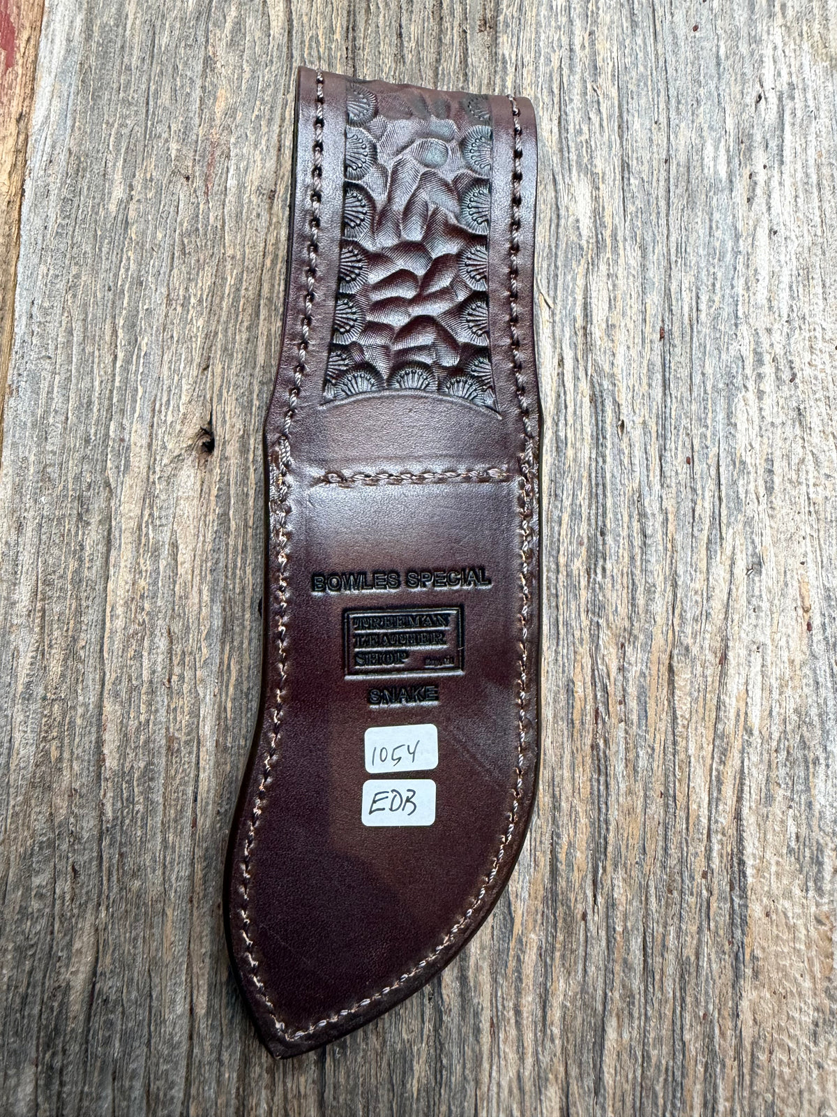 Randall Model Bowles Special sheath with an Eastern Diamondback RattleSnake skin from Treeman Sheaths. Hand tooled belt loop, canteen snap. Vibrant colors and one of the hardest skins to source.