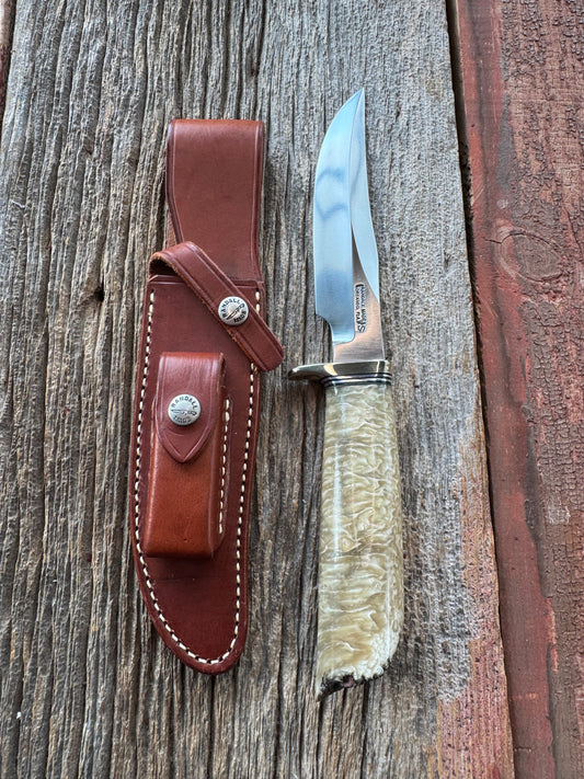 Randall Model 12-6 in Musk Ox. Natural raw end. Nickel Silver Single Hilt and Black and Aluminum spacers, stainless steel blade.