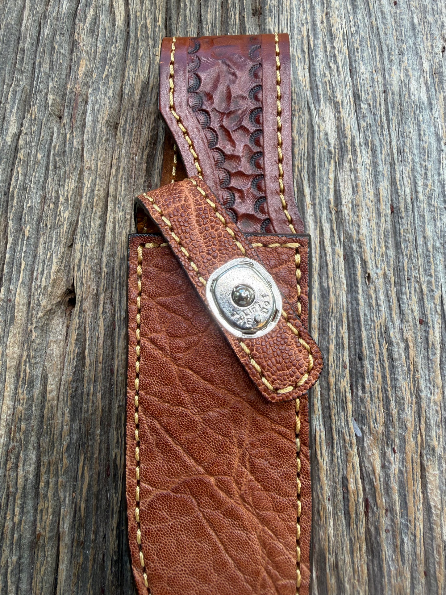 New Randall Model 23 Sheath in Exotic thick and textured Rust colored Elephant hide on brown leather from Treeman with a silver Canteen snap. Hand tooled belt loop. Killer sheath.