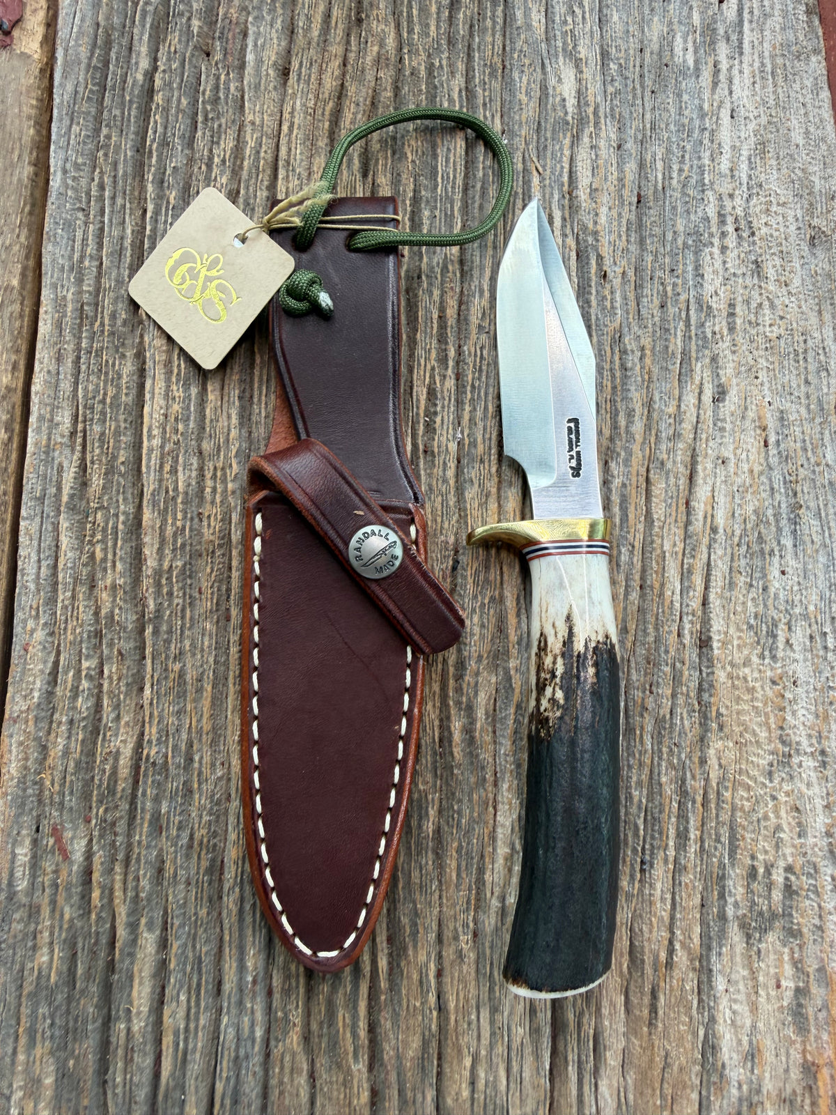 New Randall Model 8-4 with a Stag handle. Stainless steel blade, brass single hilt and natural butt. Red white and Blue spacers.
