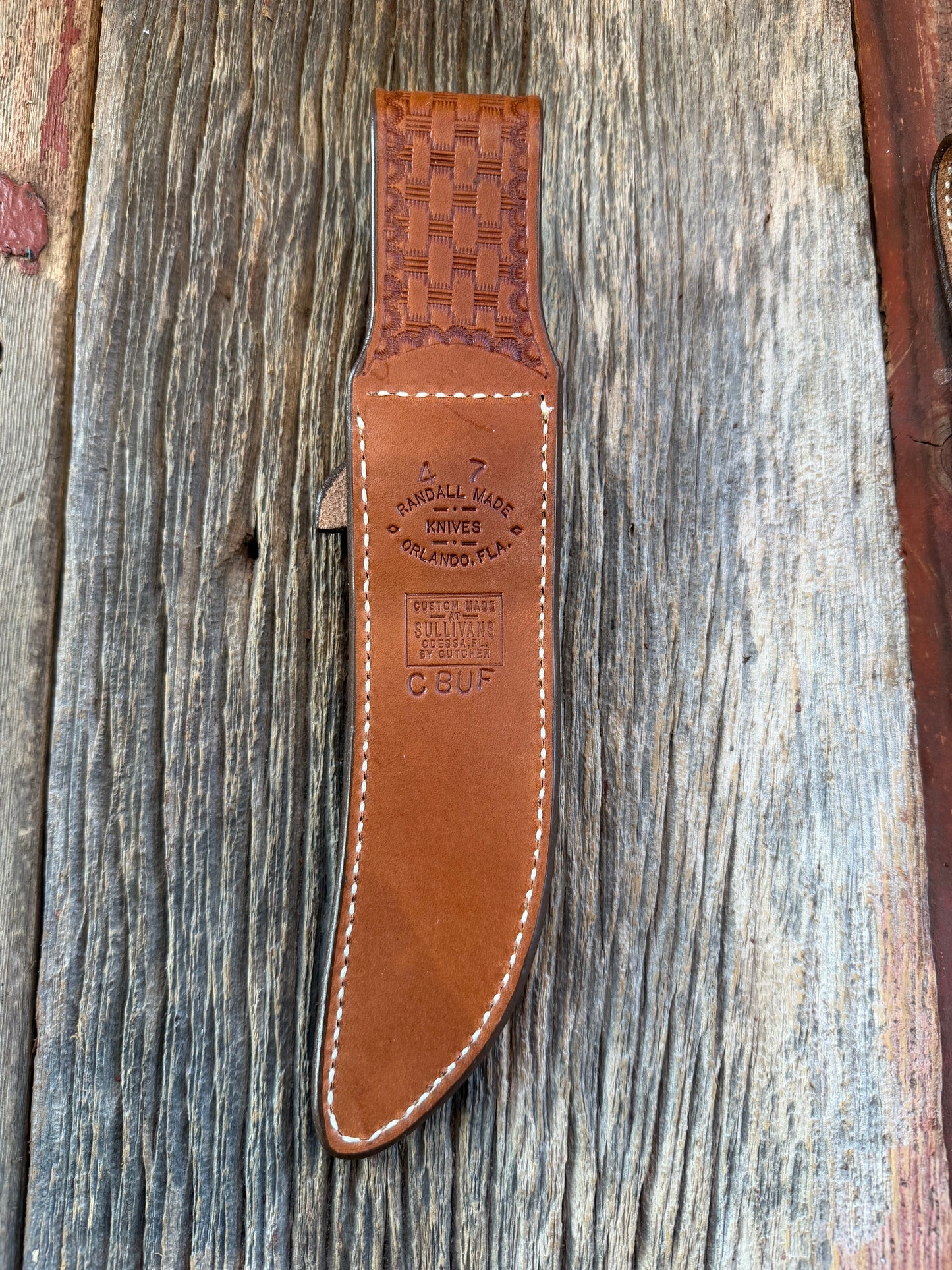 New Randall Model 4-7 Sheath in Exotic Brown Cape Buffalo with full leather hand tooled belt loop. Randall snap and stamp on the back. Custom Made at Sullivan’s by Gutcher