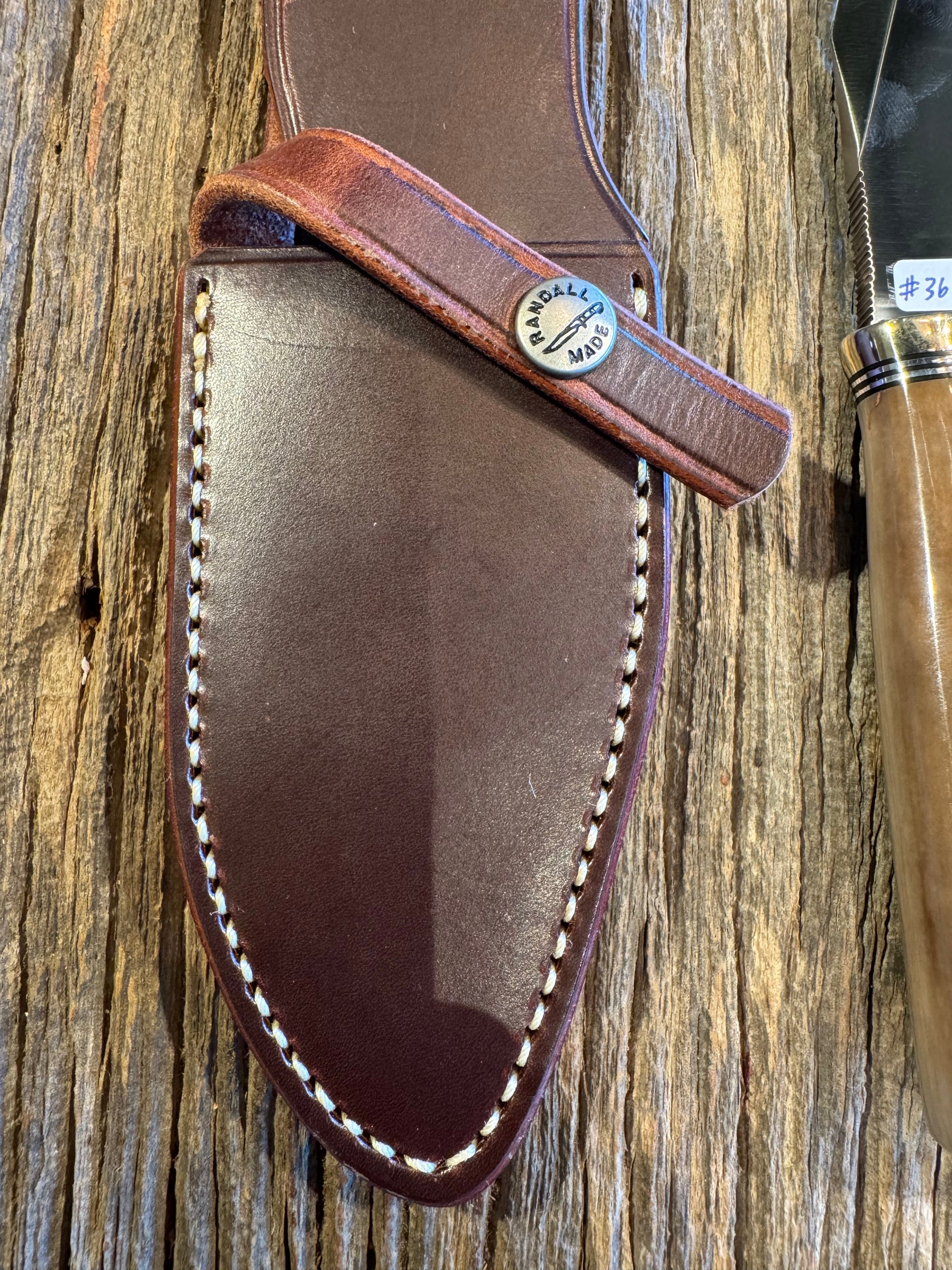 Randall Model 19-4 in Beautiful Fossil Walrus Ivory. Gorgeous colors and very rare to see a 19 in FWI. Nickel Silver Single Hilt and natural end, SS, and Flawless