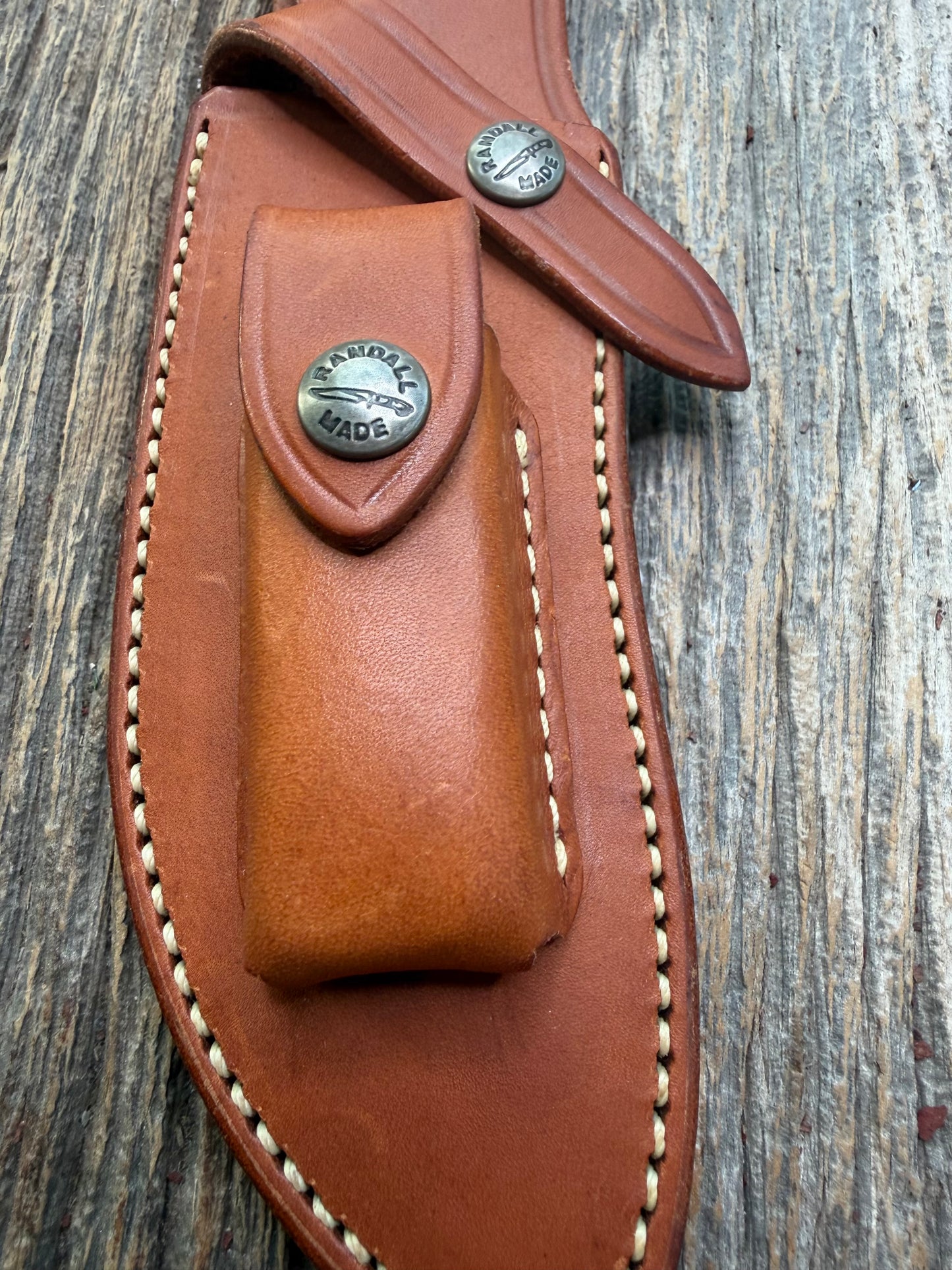 Randall by Gutcher Knife Sheath for a Model Rick Bowles Special.  Randall snaps, pouch with stone. Tuff sheath.