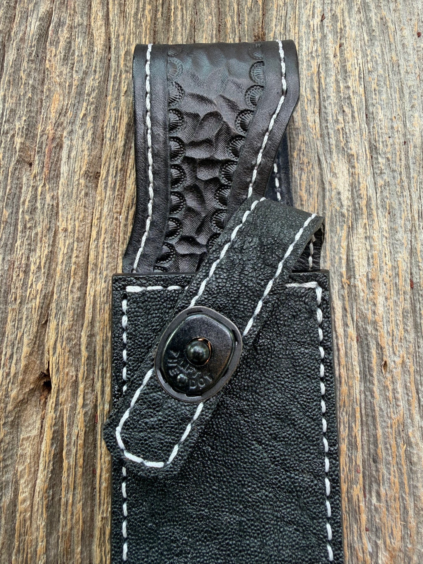 New Randall Model 1-7 Sheath in Exotic thick and textured Black Elephant hide on black leather from Treeman with a black Canteen snap. Hand tooled belt loop. Killer sheath.
