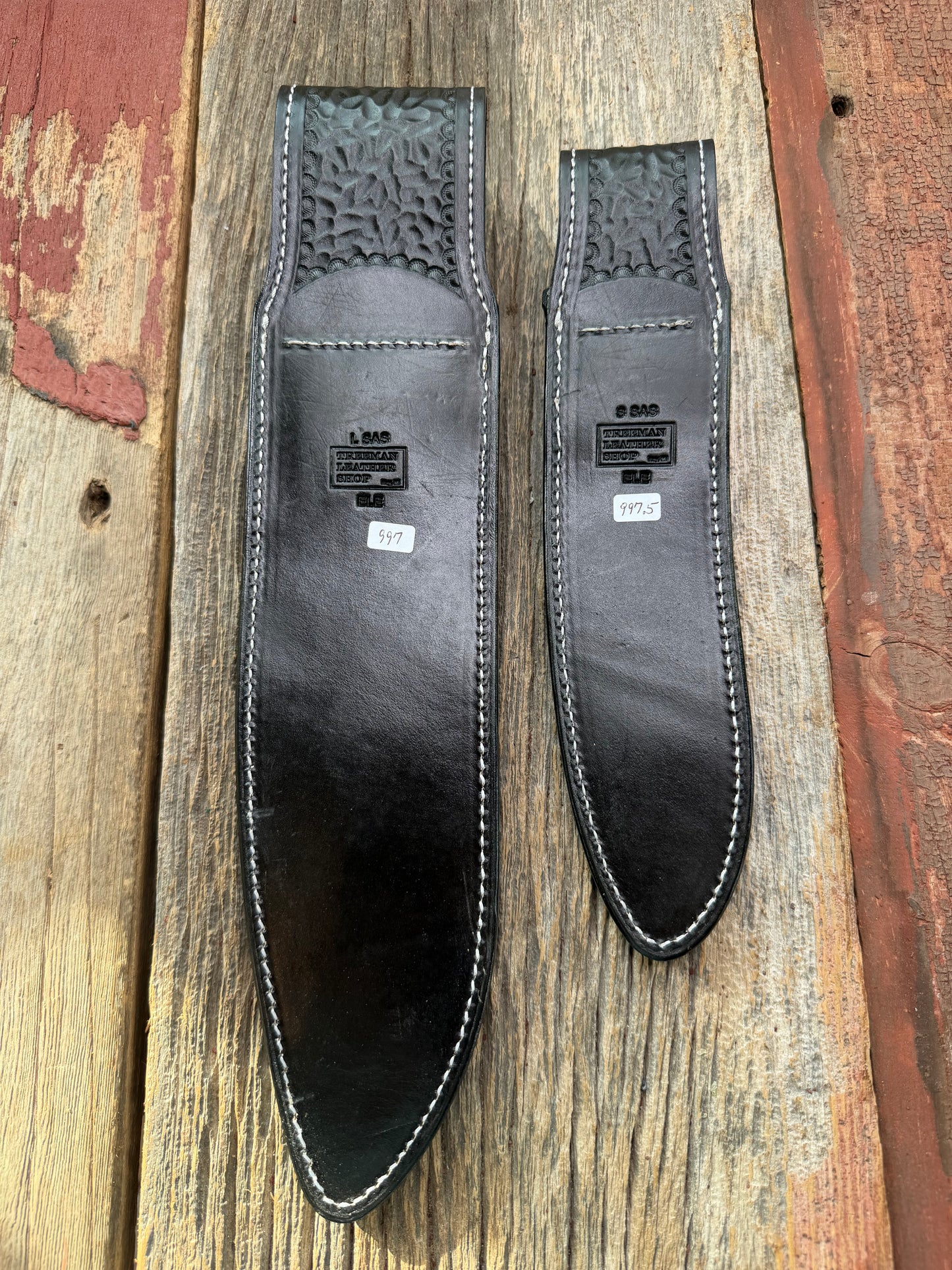 New Randall Model 12-11 Large Sasquatch and 12-8 Small Sasquatch Sheaths in Exotic thick and textured Black Elephant hide on black leather from Treeman with a black Canteen snap. Hand tooled belt loop. Killer sheath. Selling as a pair…