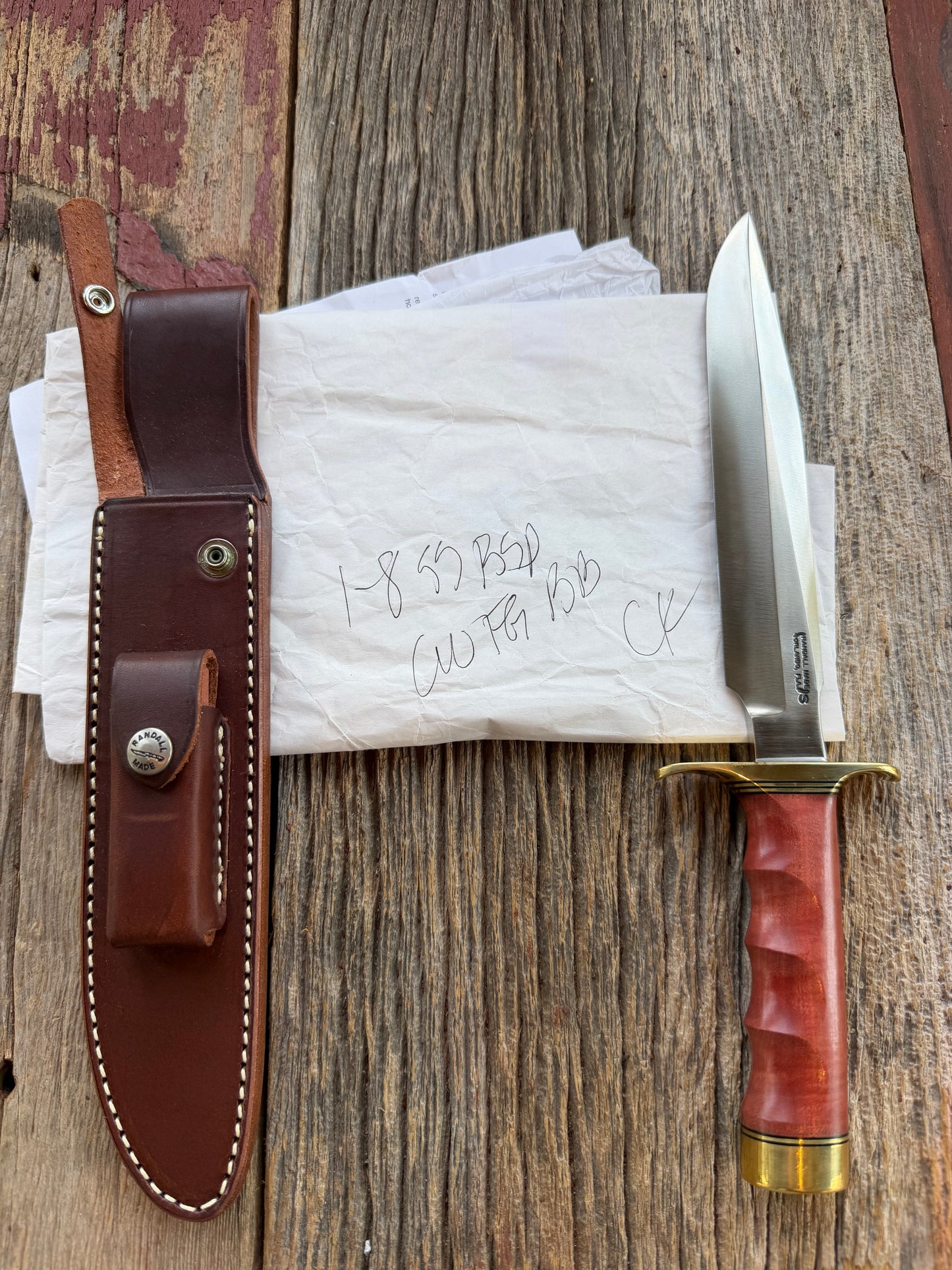 New in Paper Randall Made Knife Model 1-8 in Pink Ivory wood. Stainless steel, Black and Gold spacers, Brass Hilt and butt cap.