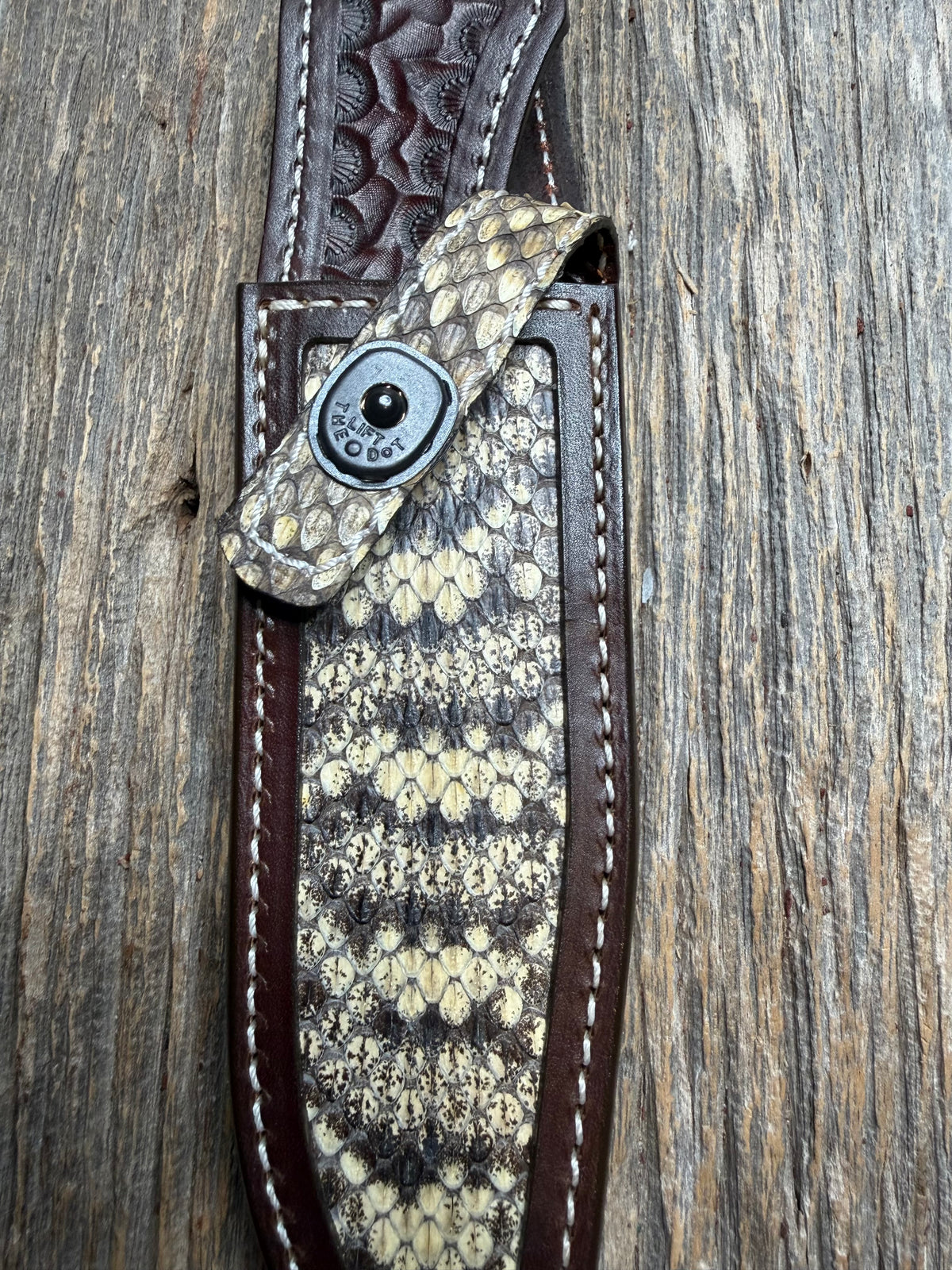 Randall Model 1-6 sheath with an Eastern Diamondback RattleSnake skin from Treeman Sheaths. Hand tooled belt loop, canteen snap. Vibrant colors and one of the hardest skins to source.