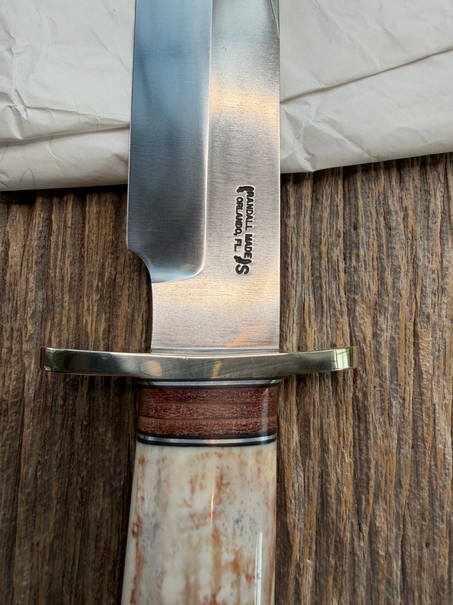 New in Paper Randall Model 12-9 Fossil Walrus Ivory and 25 style stacked Leather grip. Double Nickel Silver hilt and nickel butt cap.