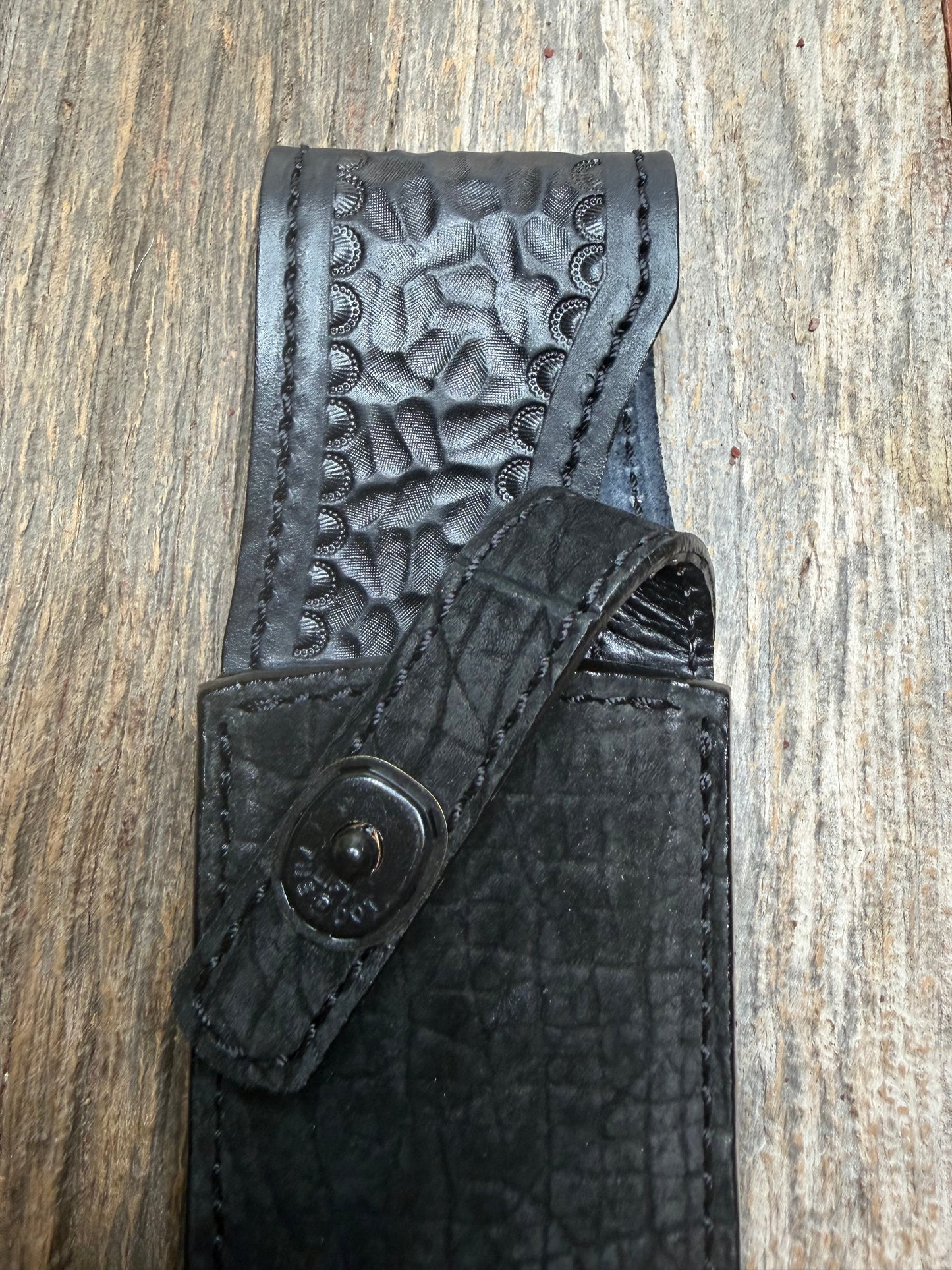 Randall Model 12-8 “Big Bear” in Black Hippo, forward curved hilt, black Canteen Snap, full brass stamping and stitching.