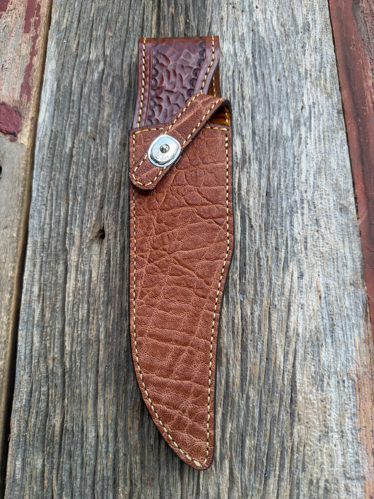 New Randall Model 12-8 Big Bear Sheath in Exotic thick and textured Rust colored Elephant hide on brown leather from Treeman with a silver Canteen snap. Hand tooled belt loop. Killer sheath.