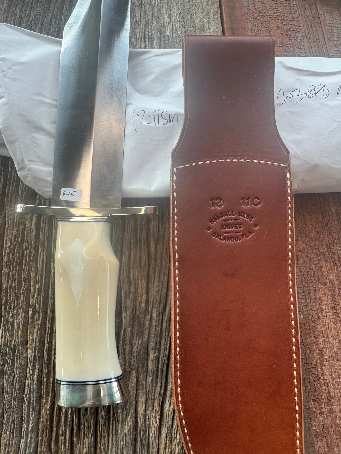 New in Paper Model 12-11 Smithsonian “Smitty” Bowie. Beautiful creamy Fossil Walrus Ivory with a single finger grip and a Nickel  Silver forward curved hilt and butt cap. Unreal Scrim opportunity!! Blank Canvas..