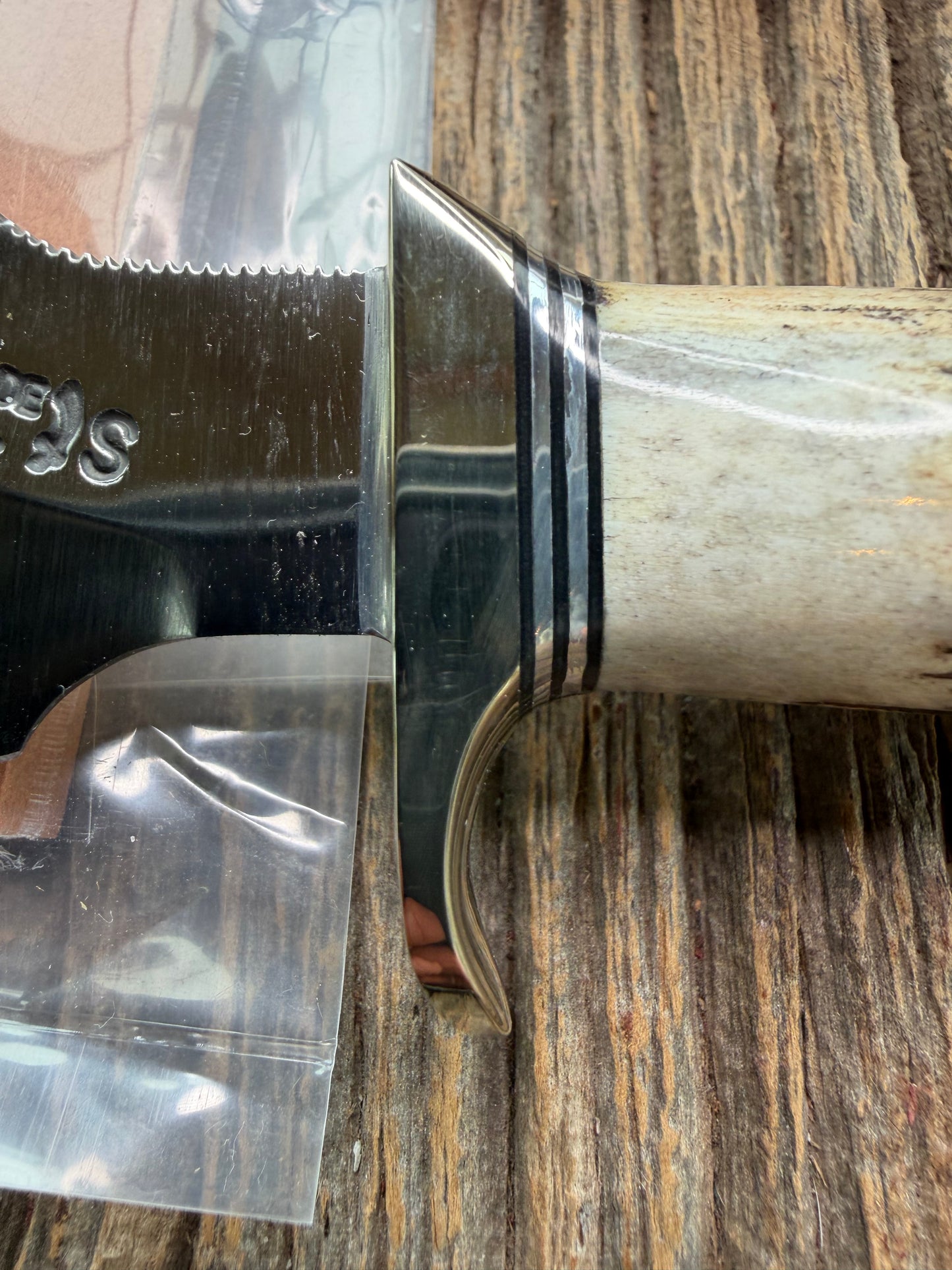 New in Paper Randall Made Knife Model 11-4 with a Stag handle, Stainless, Nickel silver single Hilt, Black and aluminum spacers.