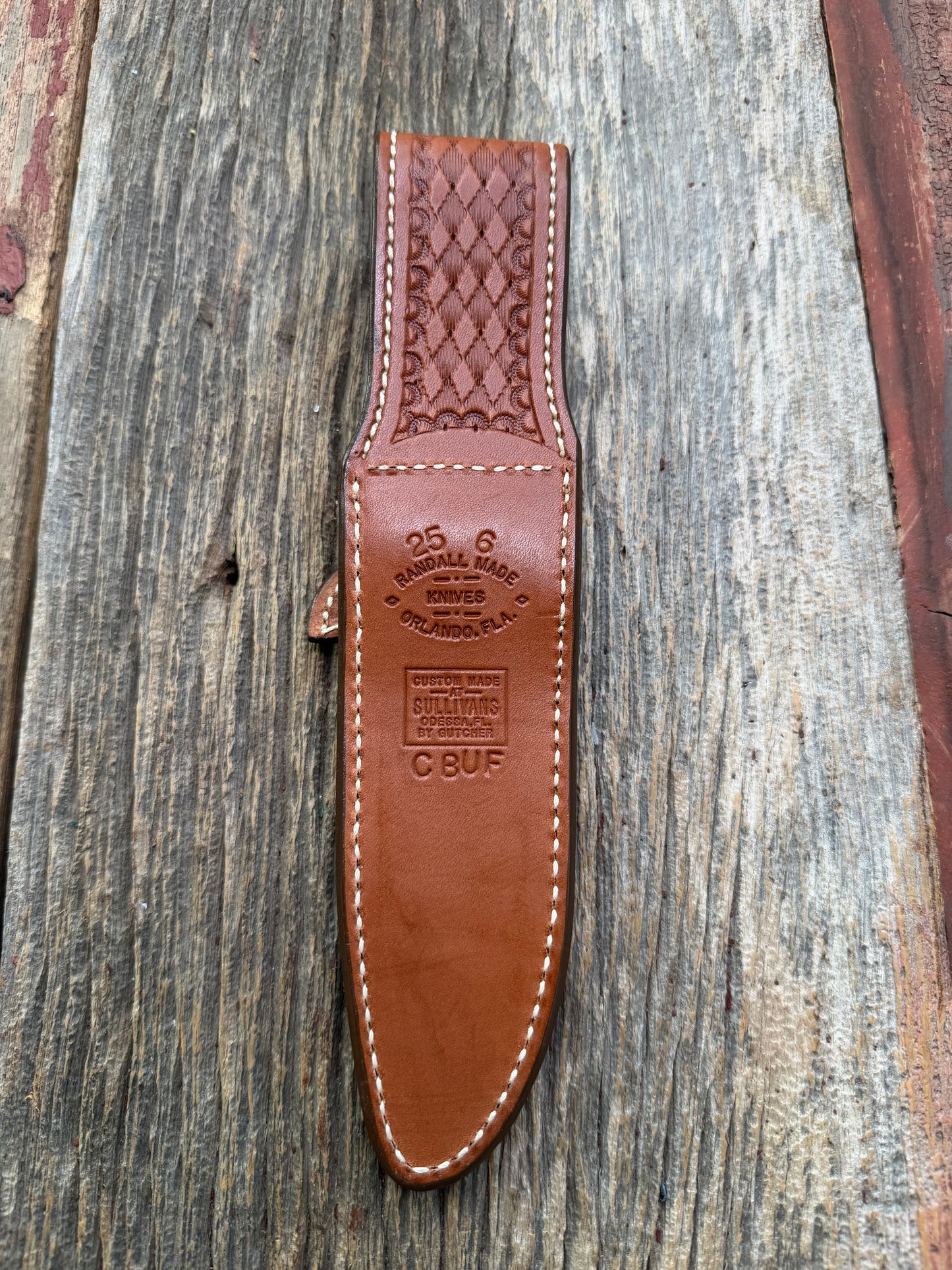 Pristine Randall Model 25-6 sheath in Exotic Cape Buffalo leather from Sullivans by Gutcher. Heavily tooled belt loop and strap. Randall snap and clean stamping on the back … perfect!!